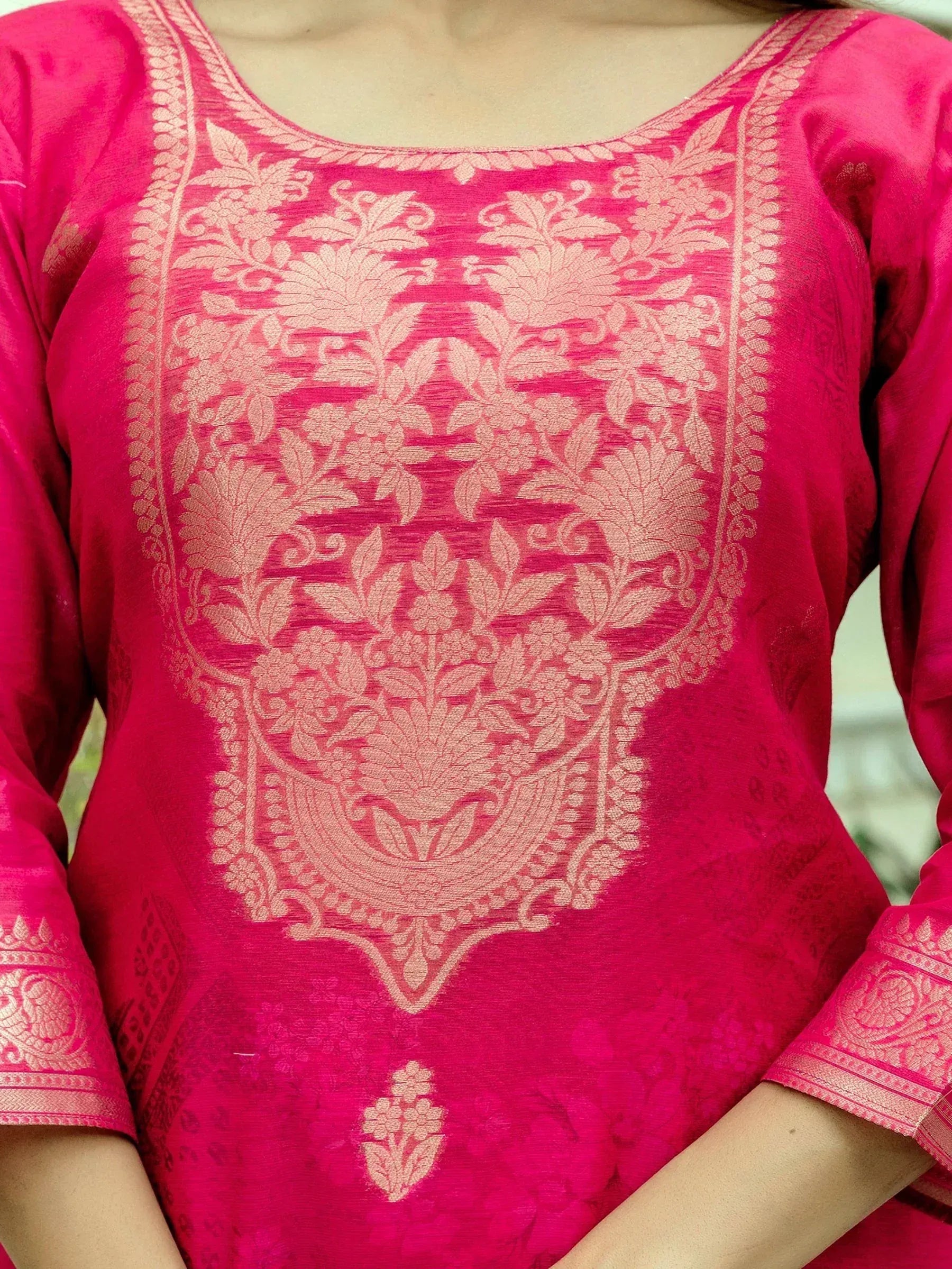 Pink ethnic kurti with intricate floral embroidery and gold detailing, perfect for Indian wear