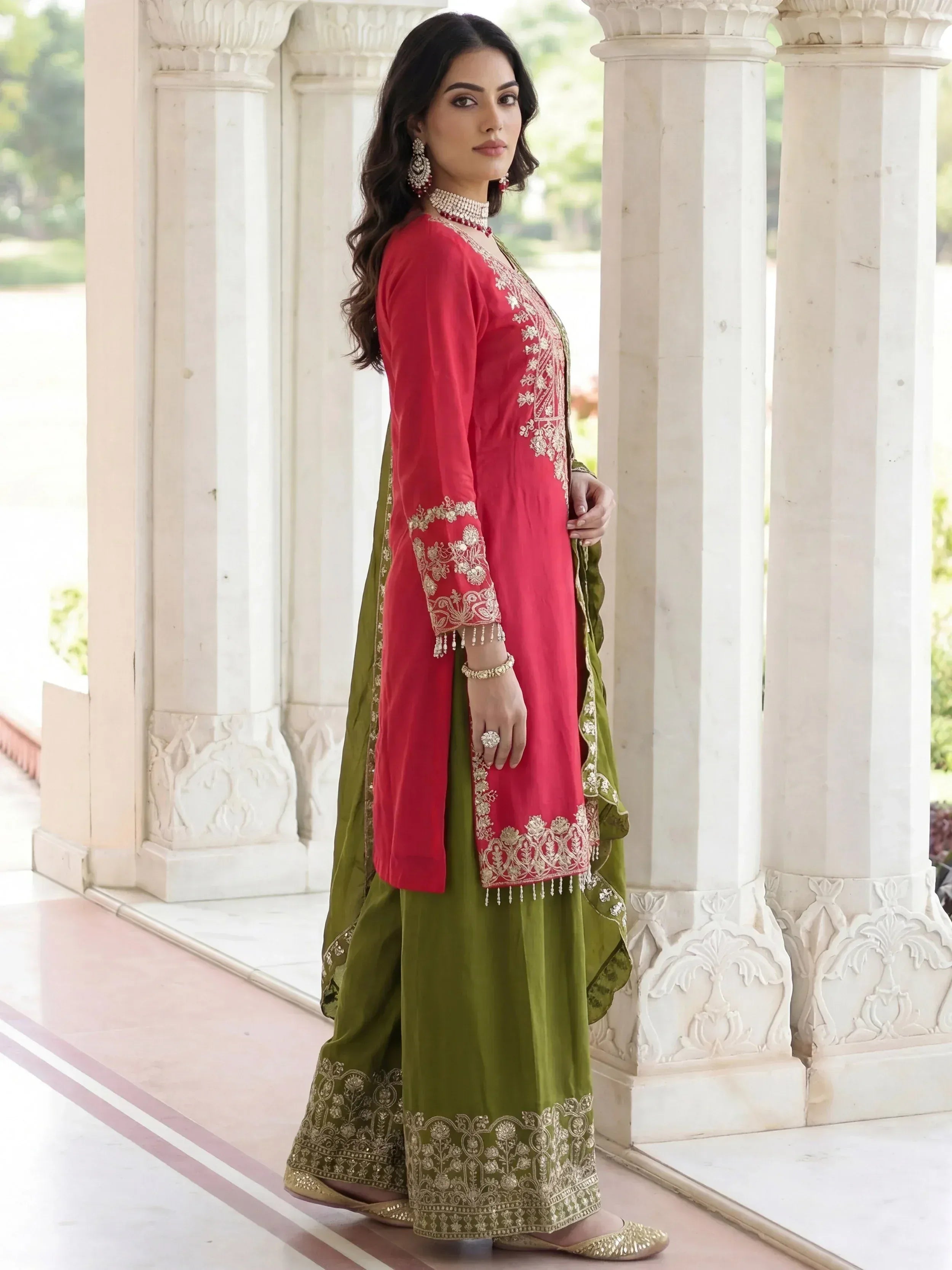 Red and green embroidered salwar kameez with gold detailing, perfect for Indian ethnic wear occasions