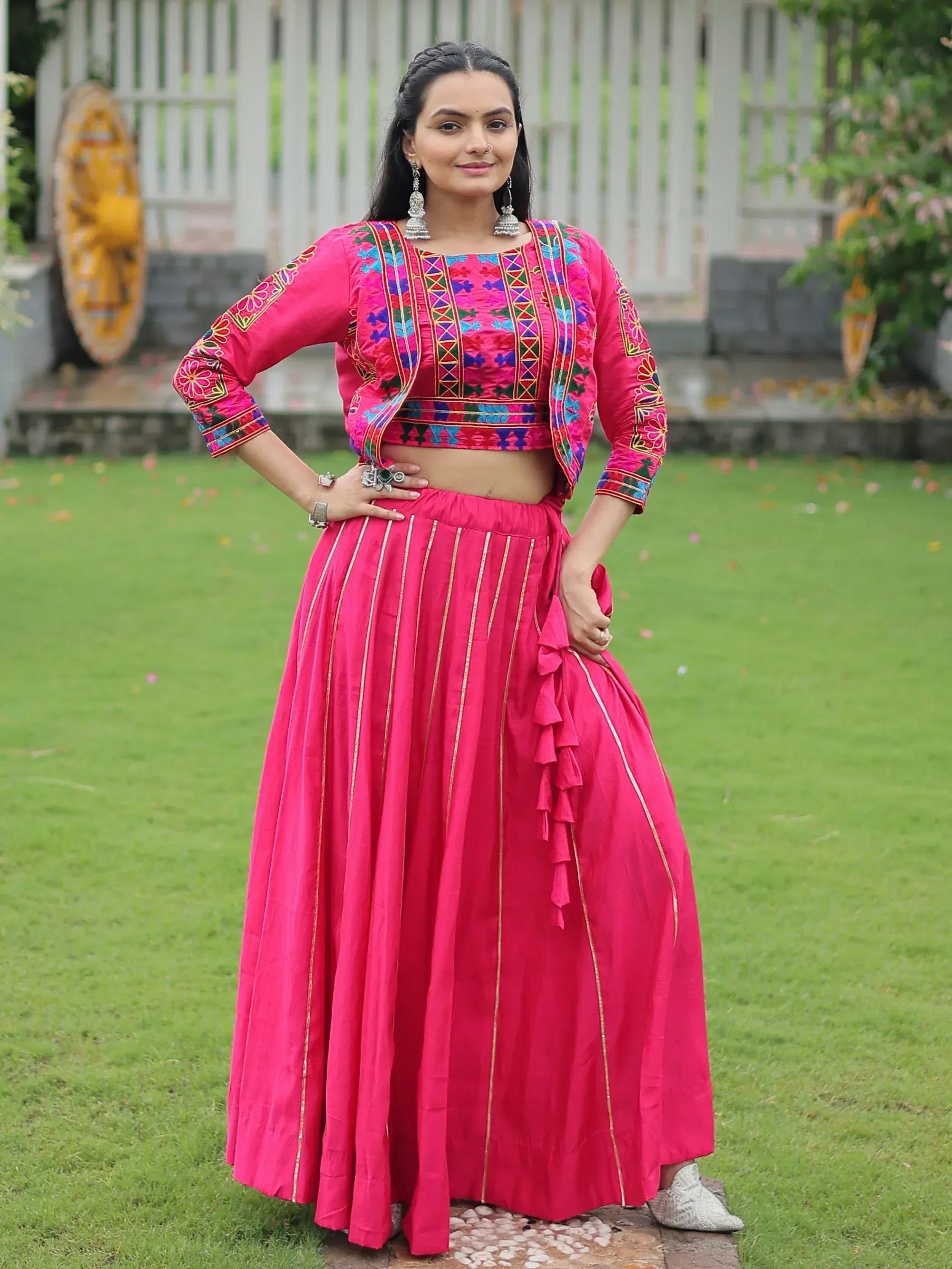 Pink embroidered lehenga choli with ruffle skirt, perfect for Indian ethnic wear occasions