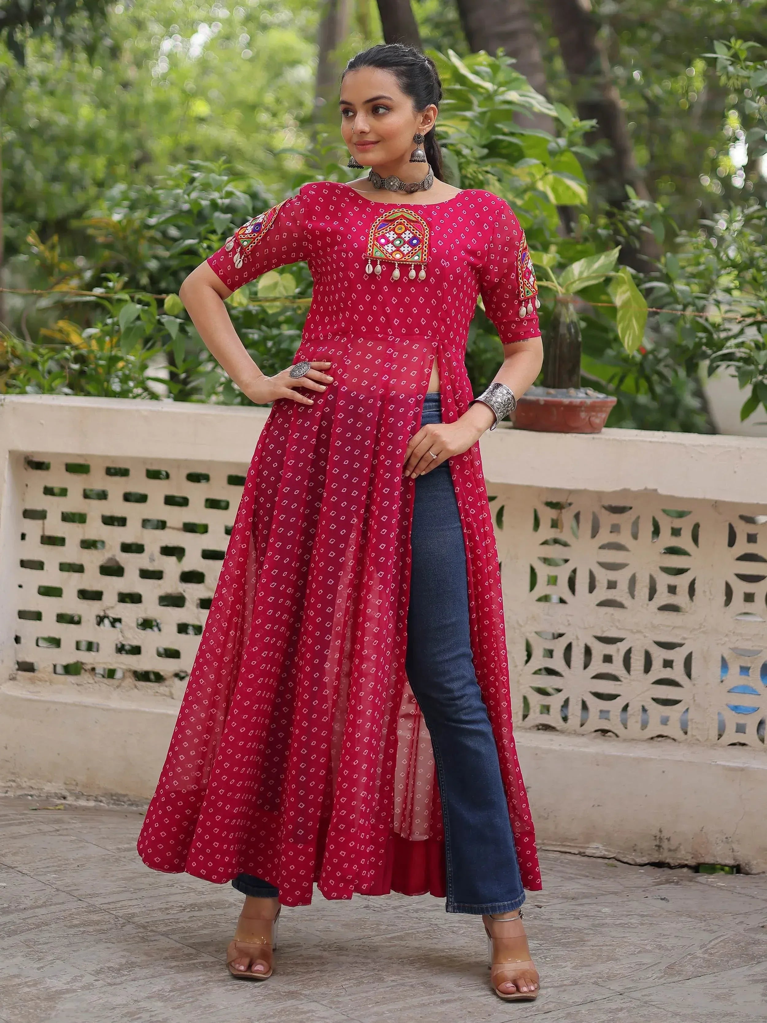Red printed ethnic kurta with mirror work, paired with jeans, for stylish Indian wear