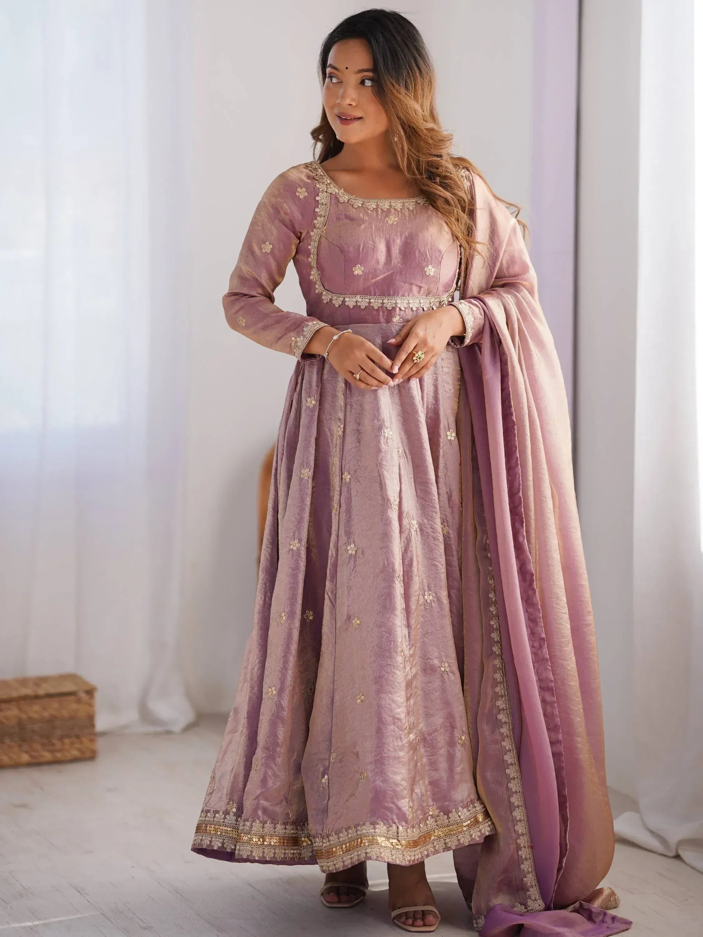 Elegant mauve Indian anarkali suit with gold floral embroidery and matching dupatta, perfect for festive occasions.