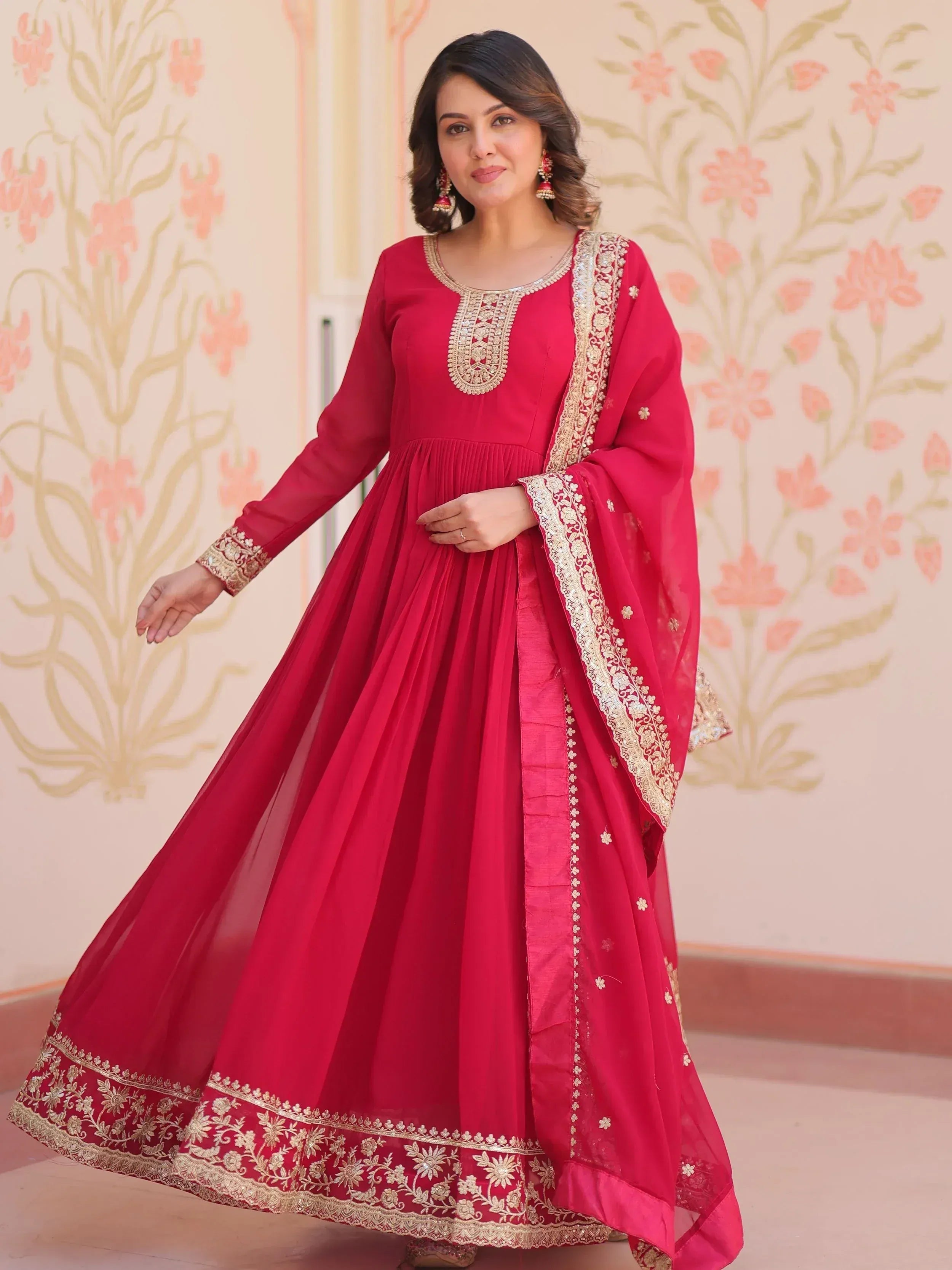 Red ethnic anarkali suit with gold embroidery, perfect for Indian weddings and festive occasions