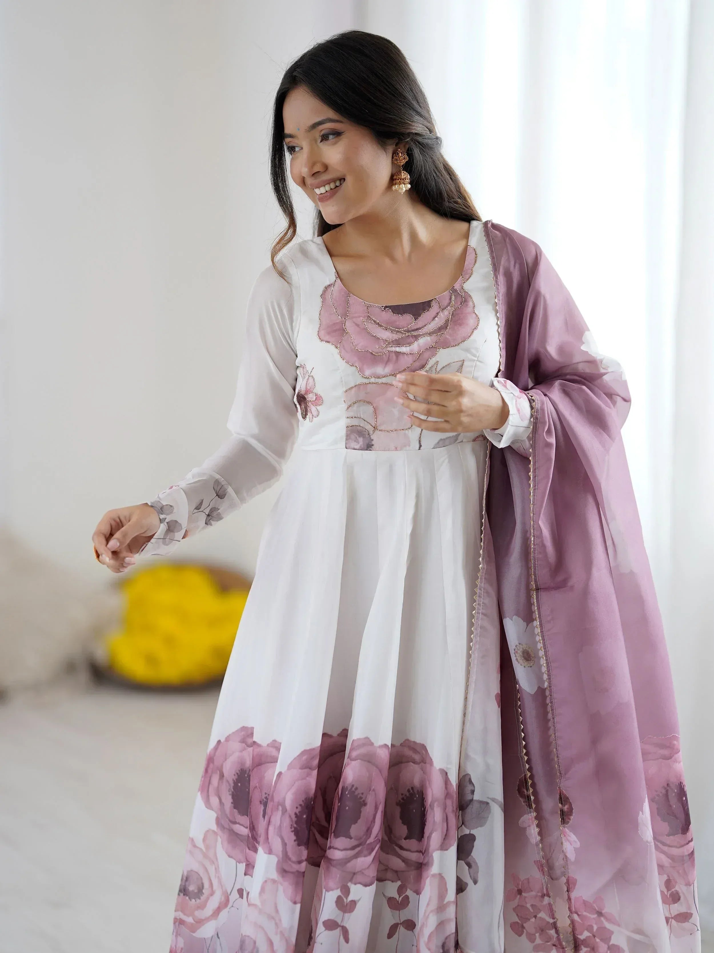 White and mauve floral print ethnic gown with matching dupatta, perfect for Indian occasions