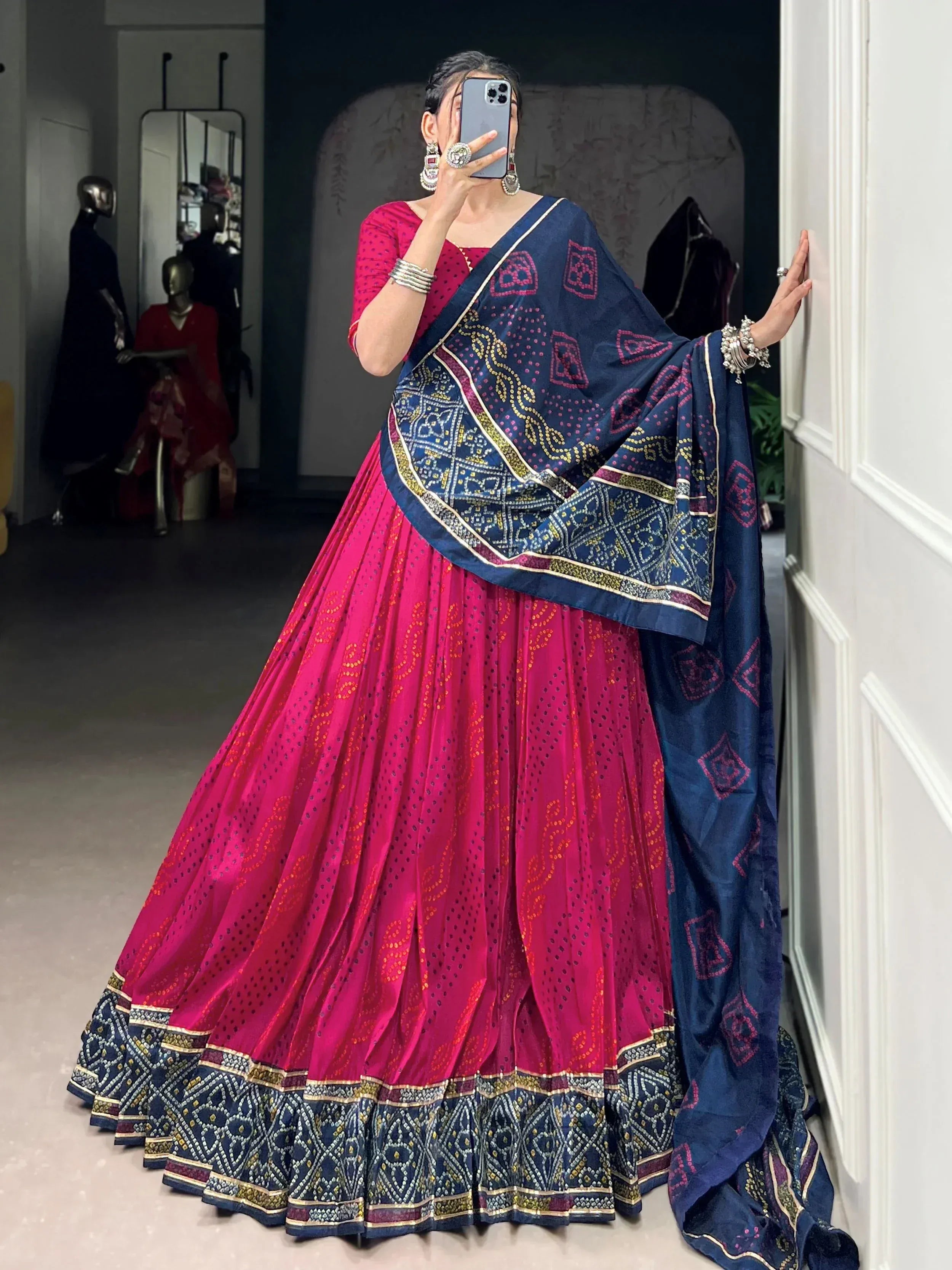 Pink and navy blue designer lehenga choli with intricate embroidery and matching dupatta, perfect for Indian ethnic wear.