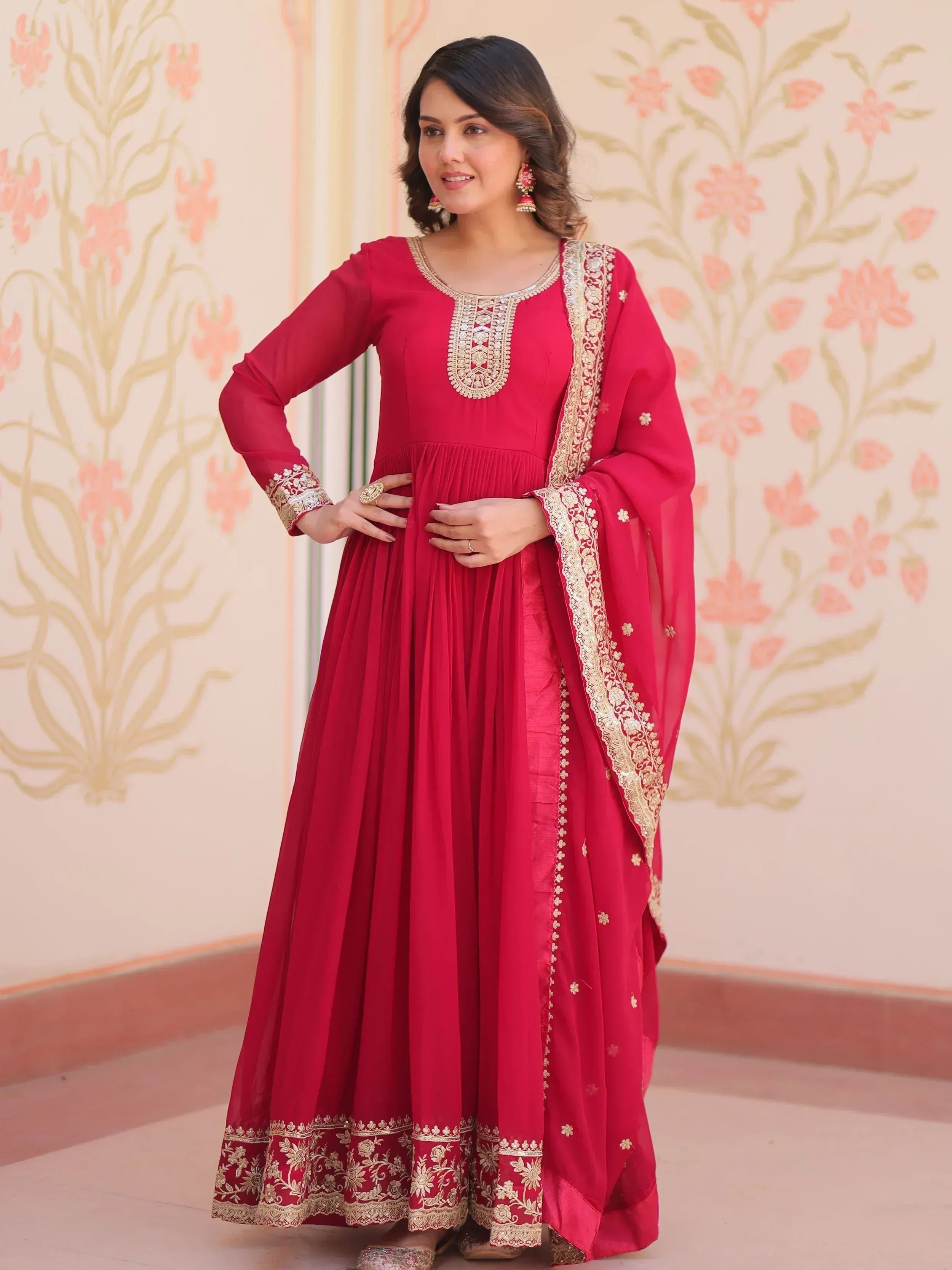 Red ethnic anarkali suit with gold embroidery, perfect for Indian weddings and festive occasions