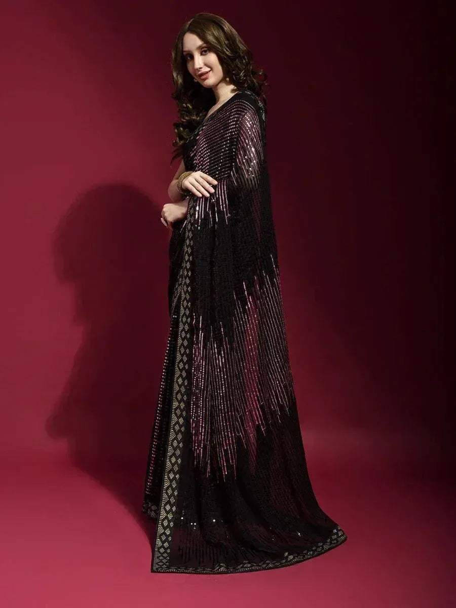 Elegant black sequin saree with gold border, perfect for Indian ethnic wear and festive occasions.
