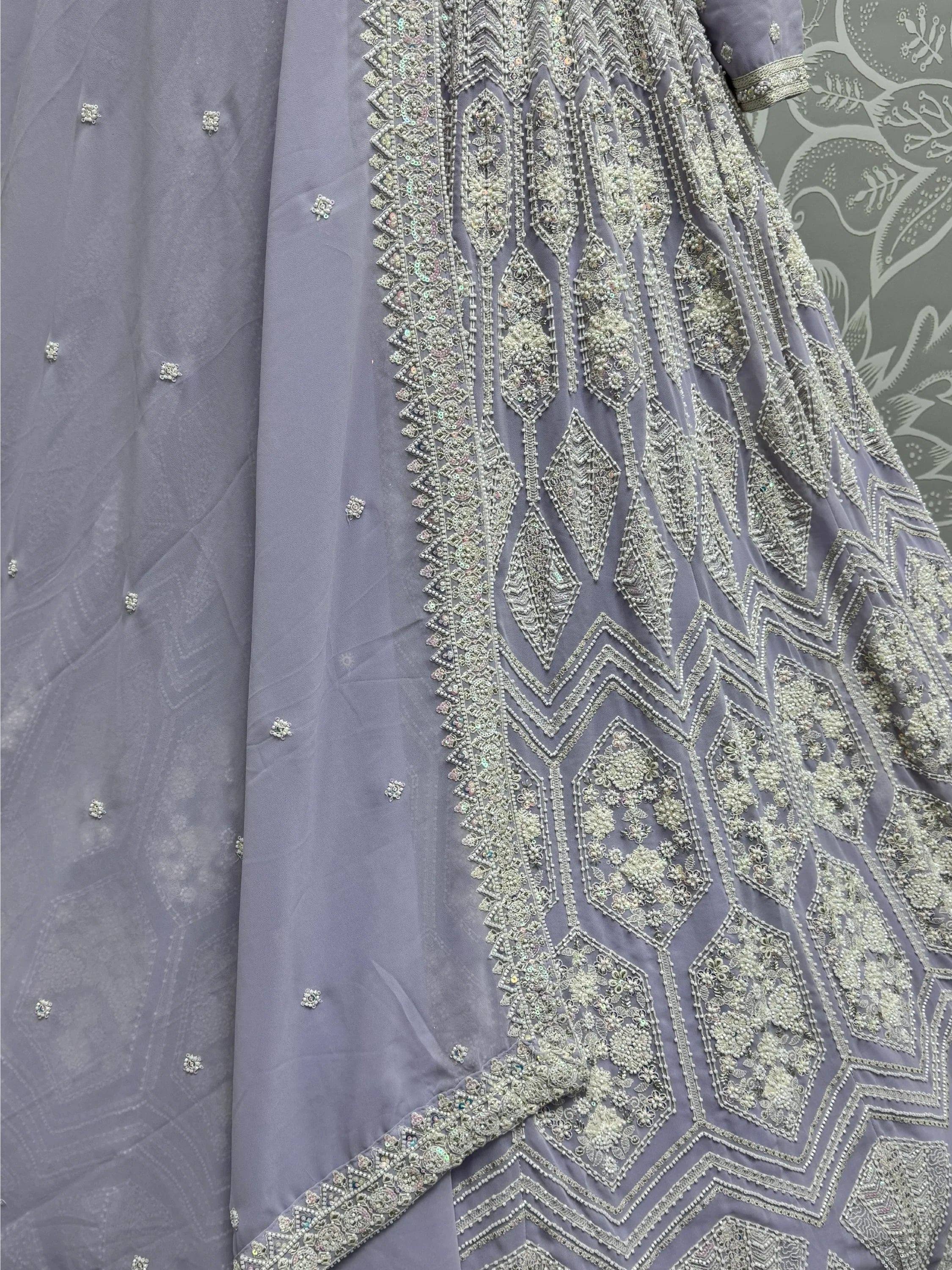 Grey ethnic gown with intricate silver beadwork and sequin embroidery, perfect for Indian celebrations.