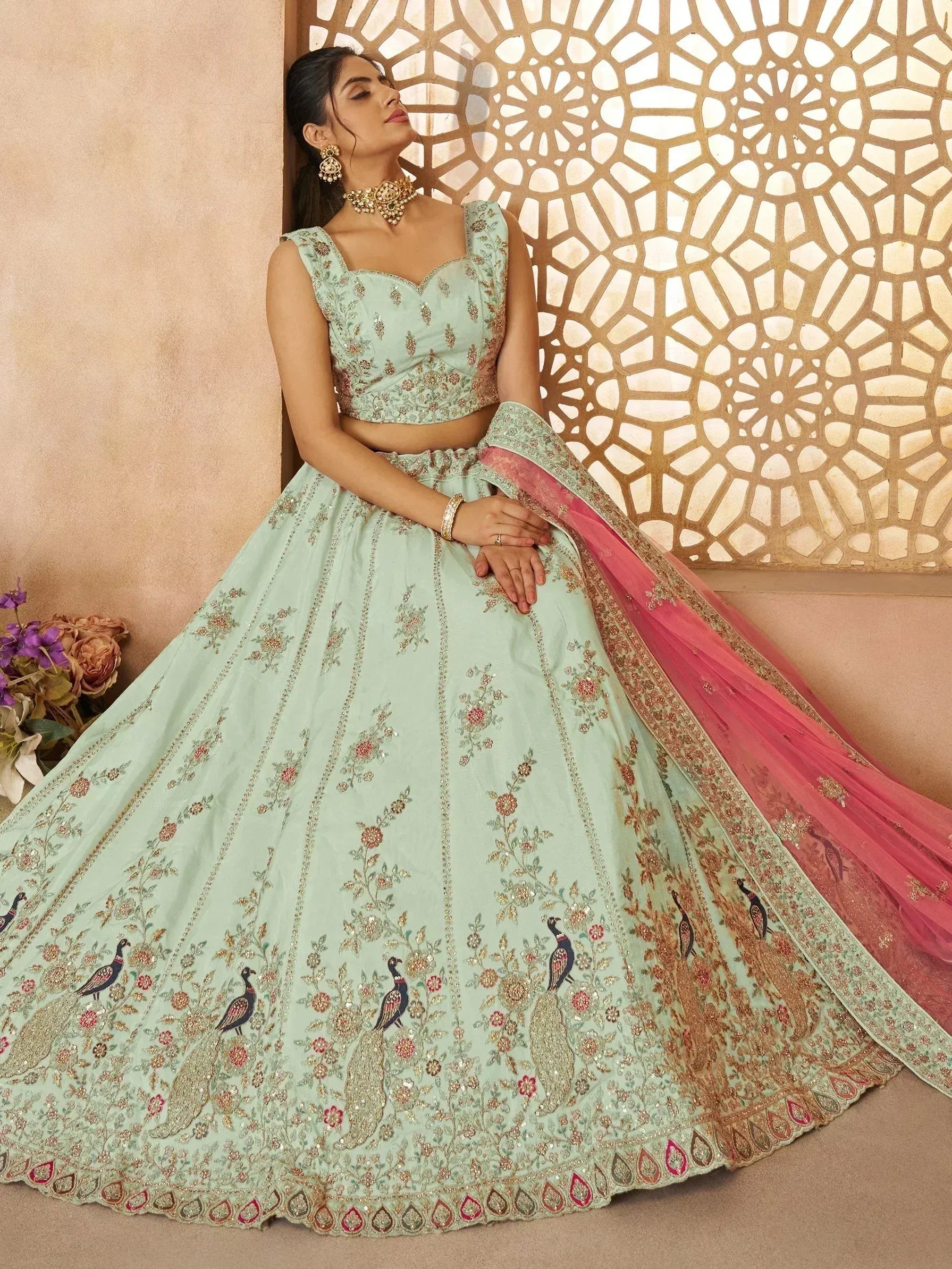Mint green designer lehenga choli with peacock embroidery and pink dupatta, perfect for Indian ethnic occasions