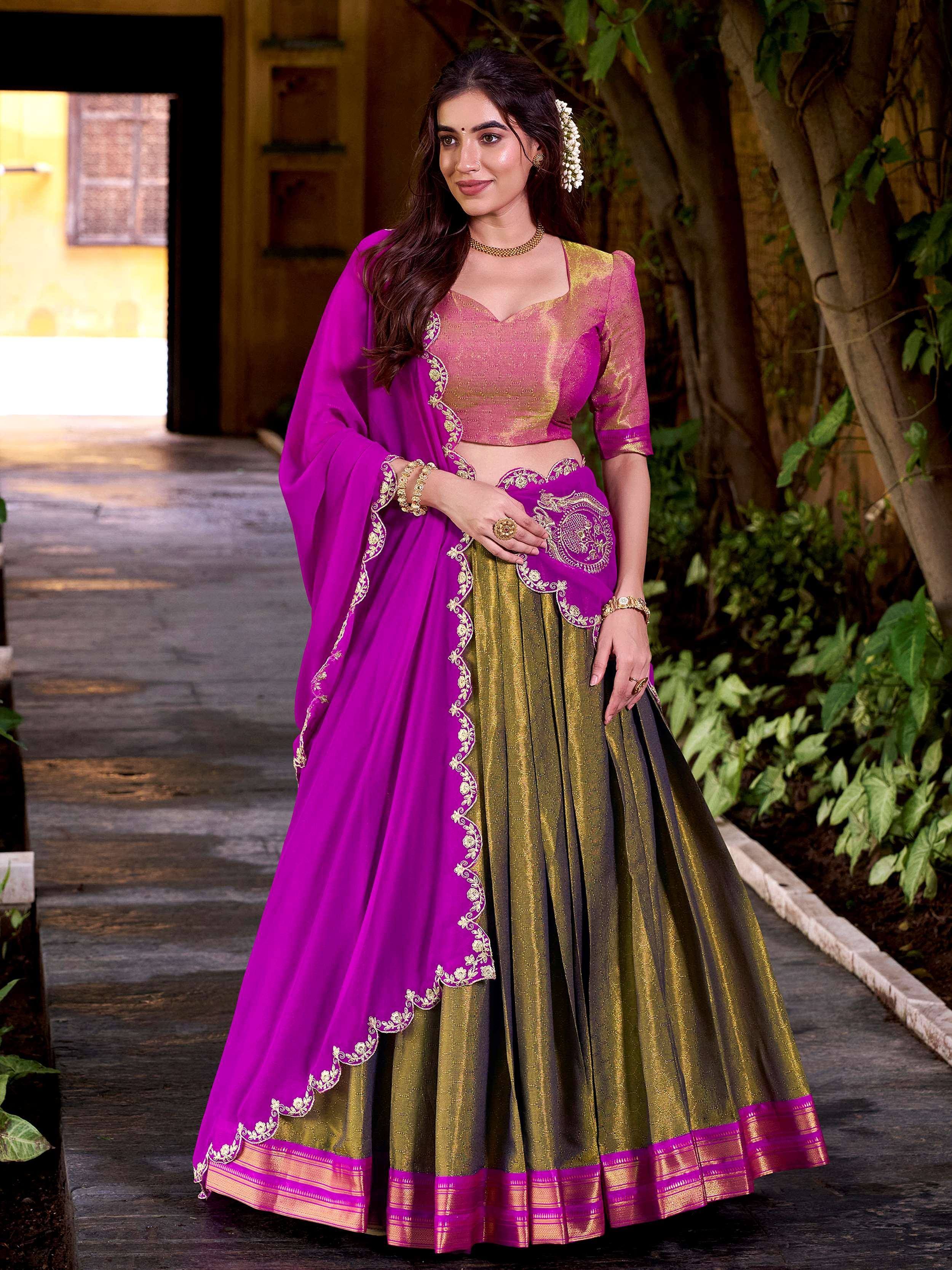 Vibrant purple and gold lehenga choli with intricate embroidery for ethnic occasions