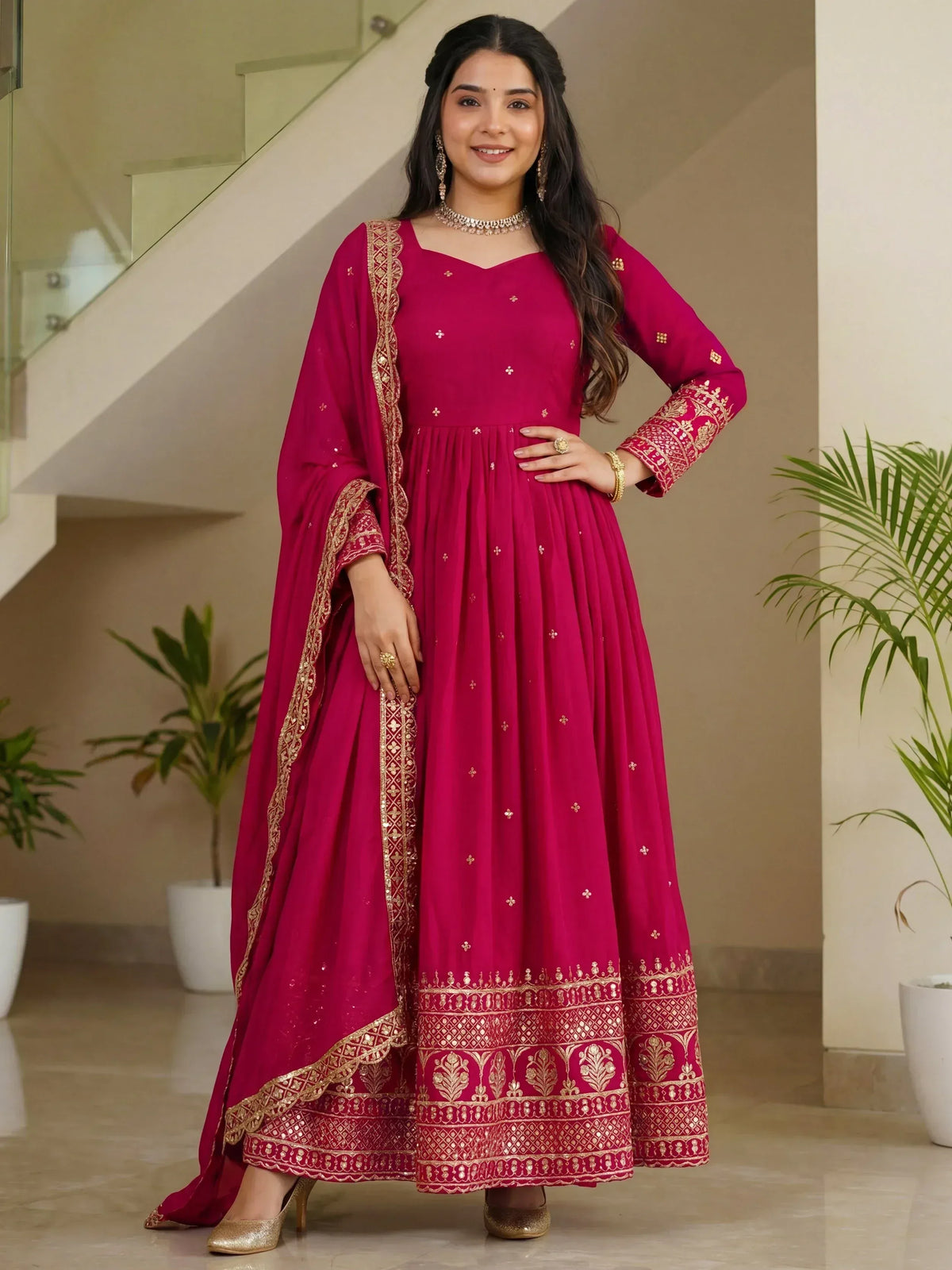 Magenta ethnic anarkali gown with gold embroidery, perfect for Indian weddings and festive occasions