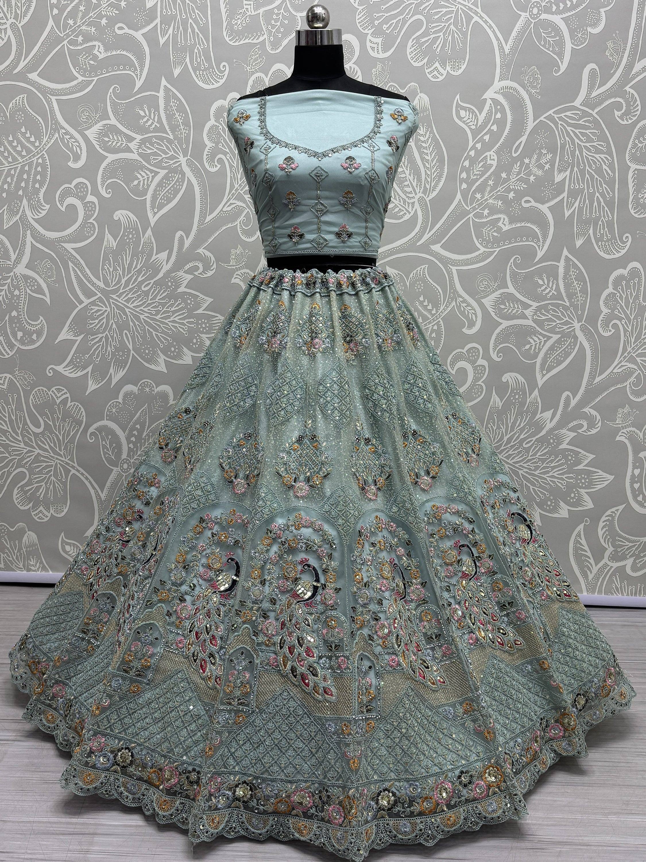Mint green designer lehenga choli with peacock embroidery and floral embellishments for Indian ethnic wear