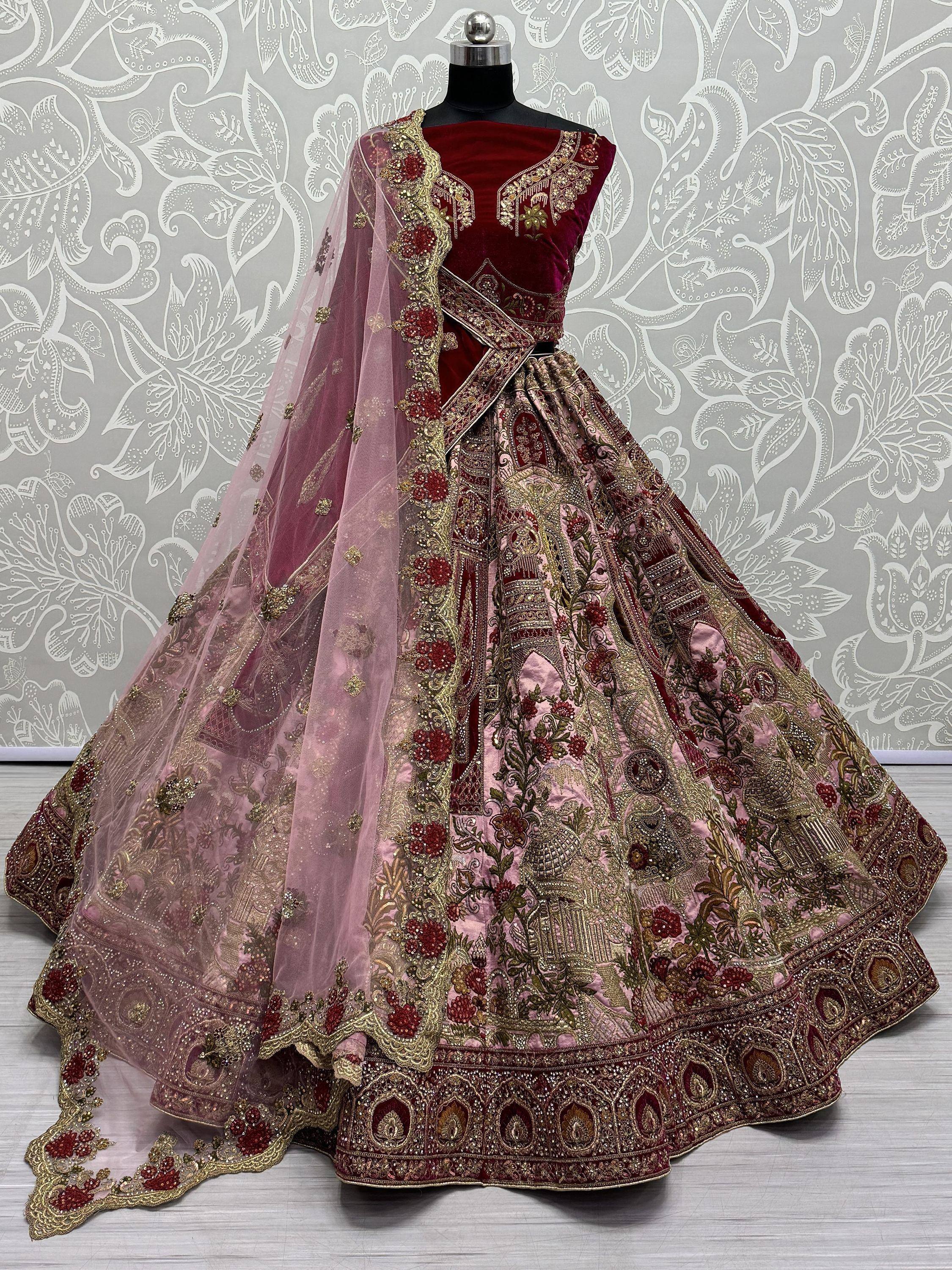 Luxury maroon and pink embroidered lehenga choli with velvet blouse and net dupatta, perfect for weddings