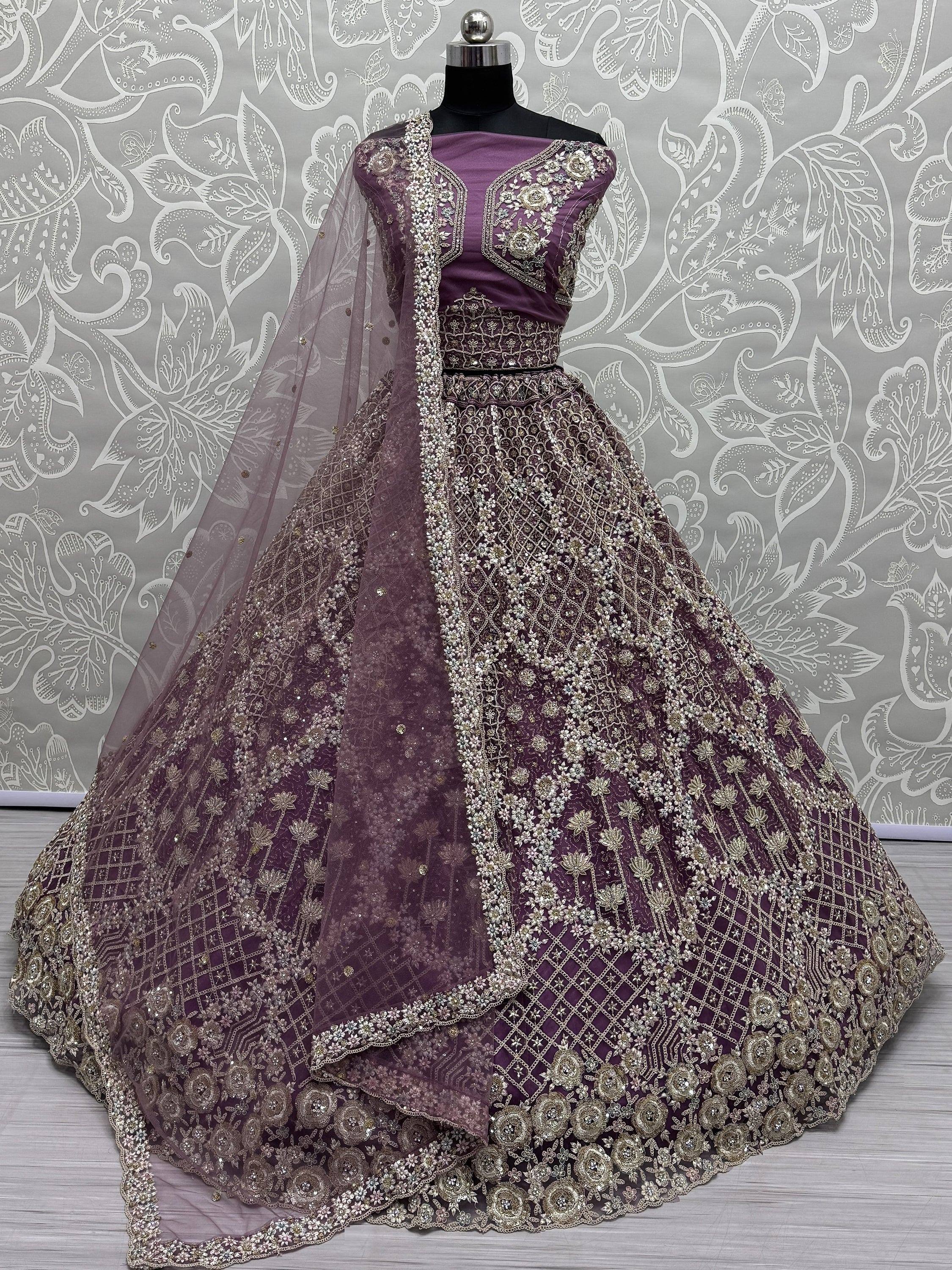 Purple designer lehenga choli with heavy gold embroidery and net dupatta, ethnic Indian wear