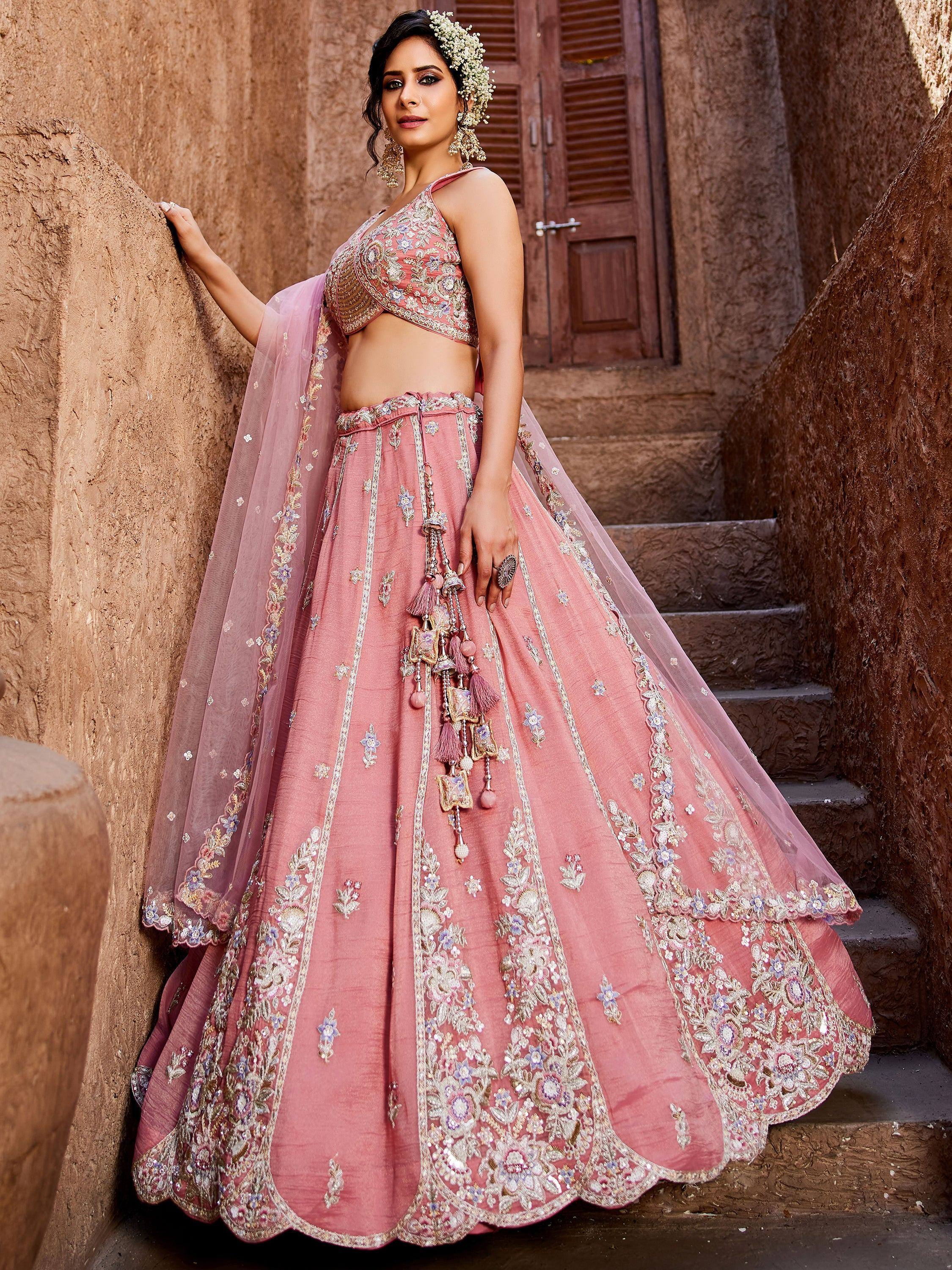 Pink embroidered lehenga choli with floral detailing, perfect for Indian weddings and festive occasions.
