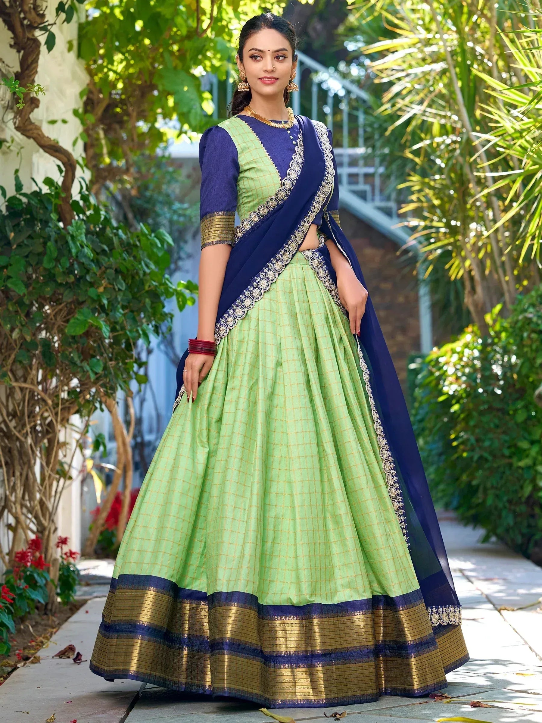 Green and navy blue designer lehenga choli with gold border and embroidery, perfect for Indian ethnic wear