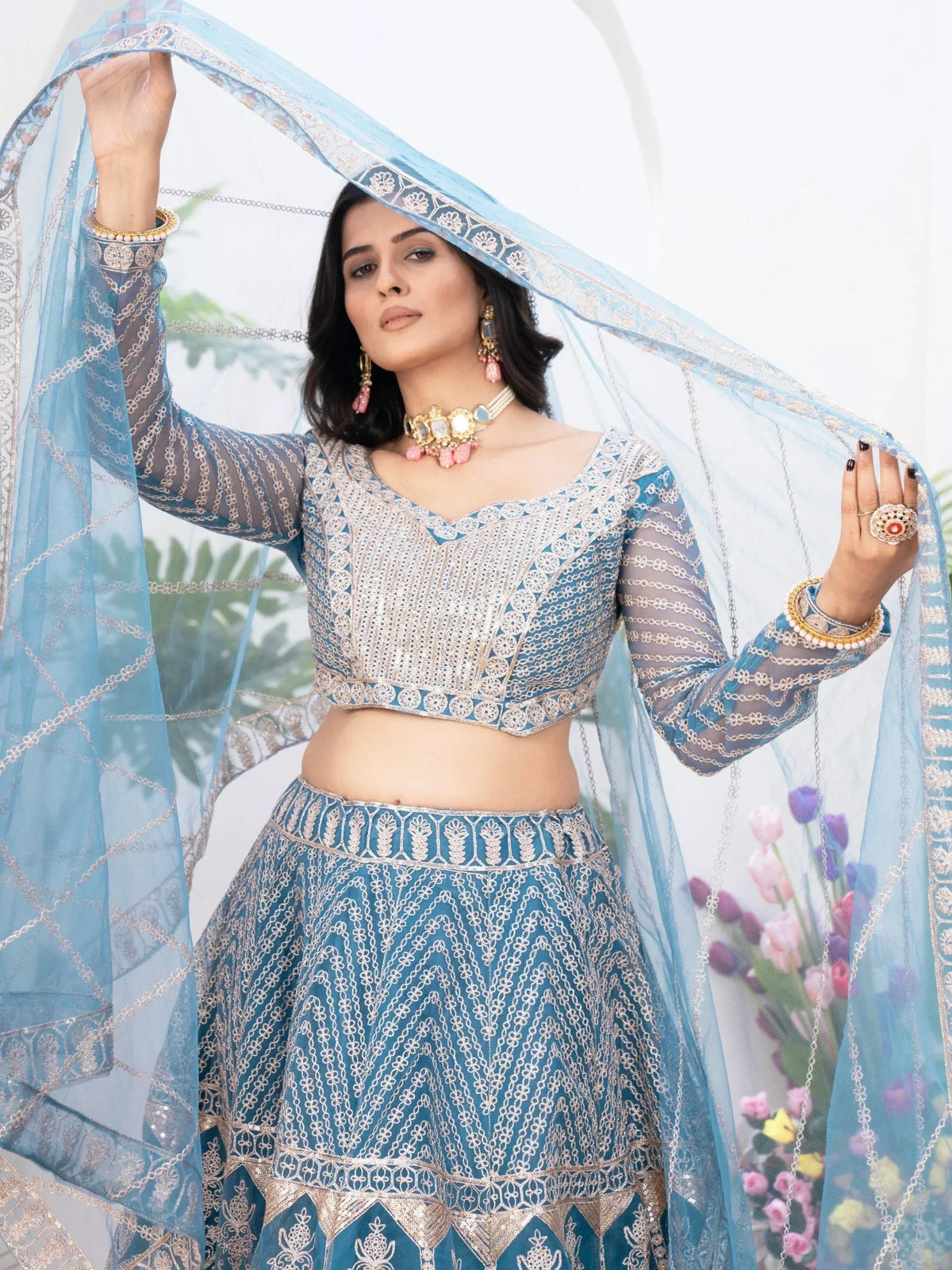 Blue embroidered lehenga choli with sheer dupatta, perfect for Indian ethnic wear and festive occasions.