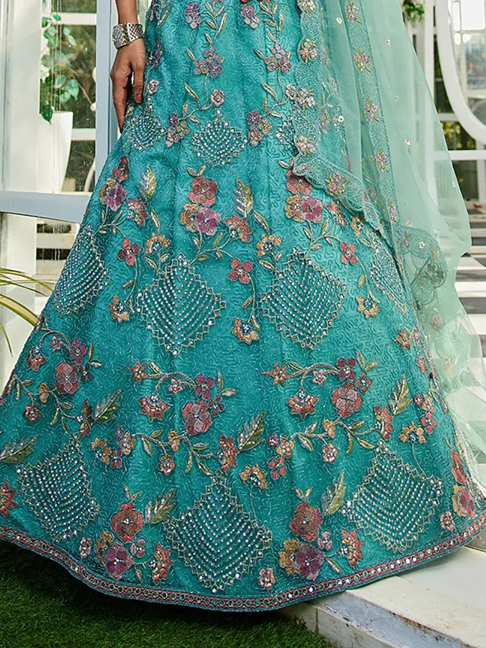 Teal floral embroidered lehenga with mirror work, perfect for Indian ethnic wear events