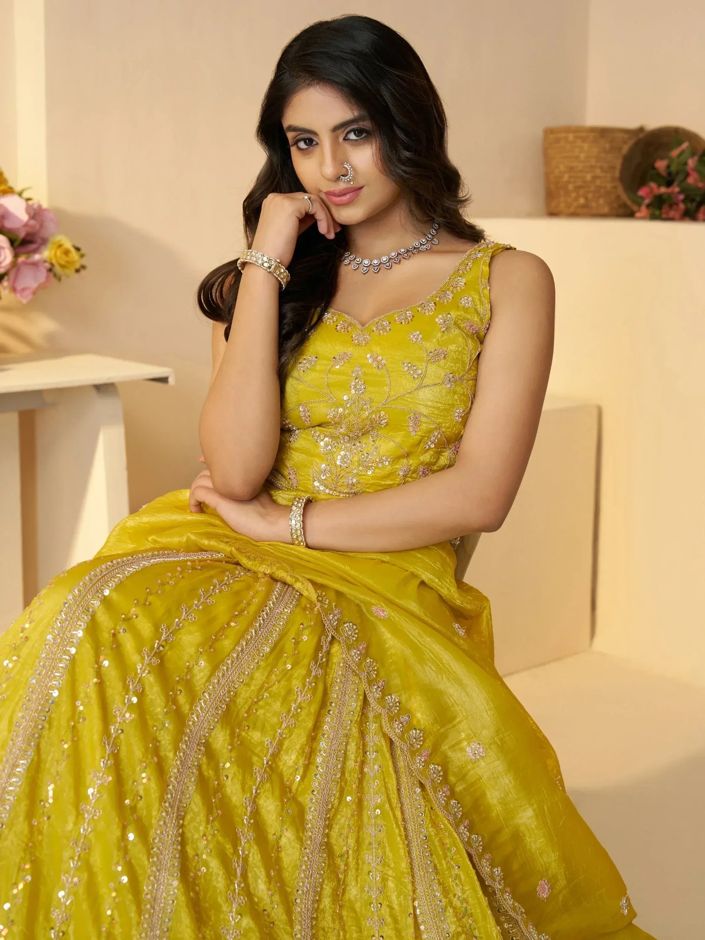Yellow embroidered lehenga choli with floral detailing, perfect for Indian ethnic wear occasions