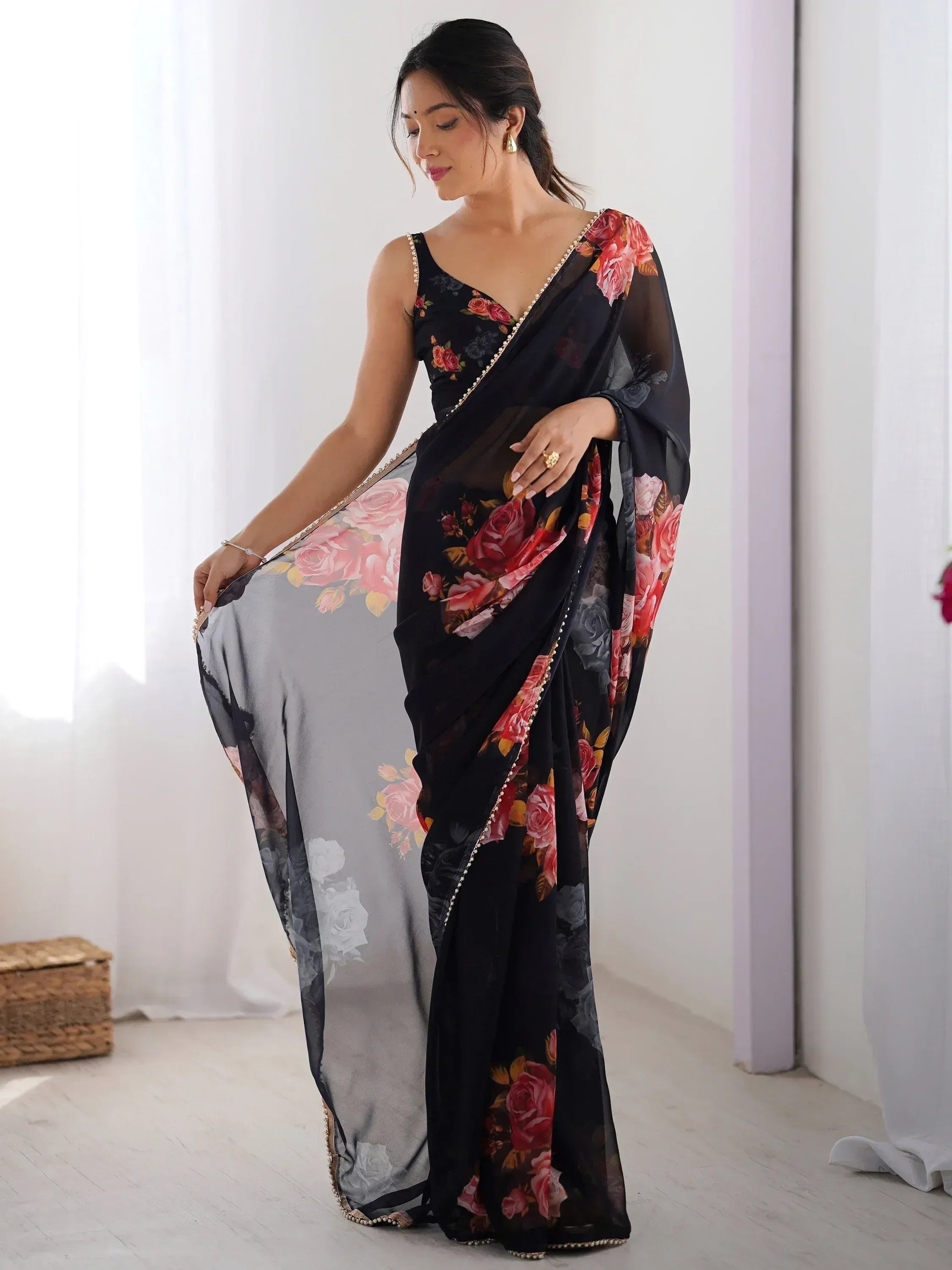 Black floral saree with pearl border, elegant Indian ethnic wear for women