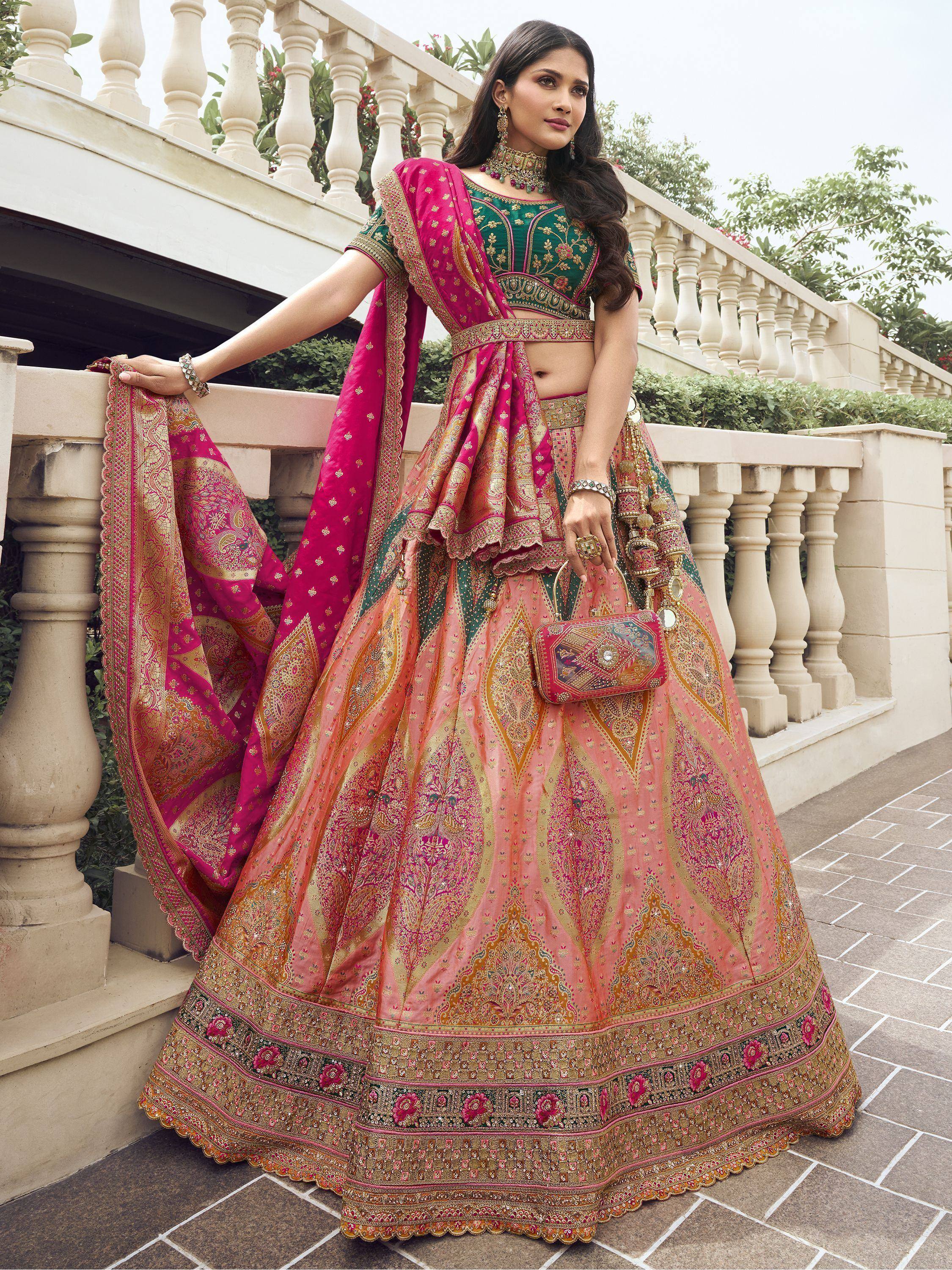 Elegant pink and green designer lehenga choli with intricate gold embroidery, perfect for Indian weddings and festive occasions.