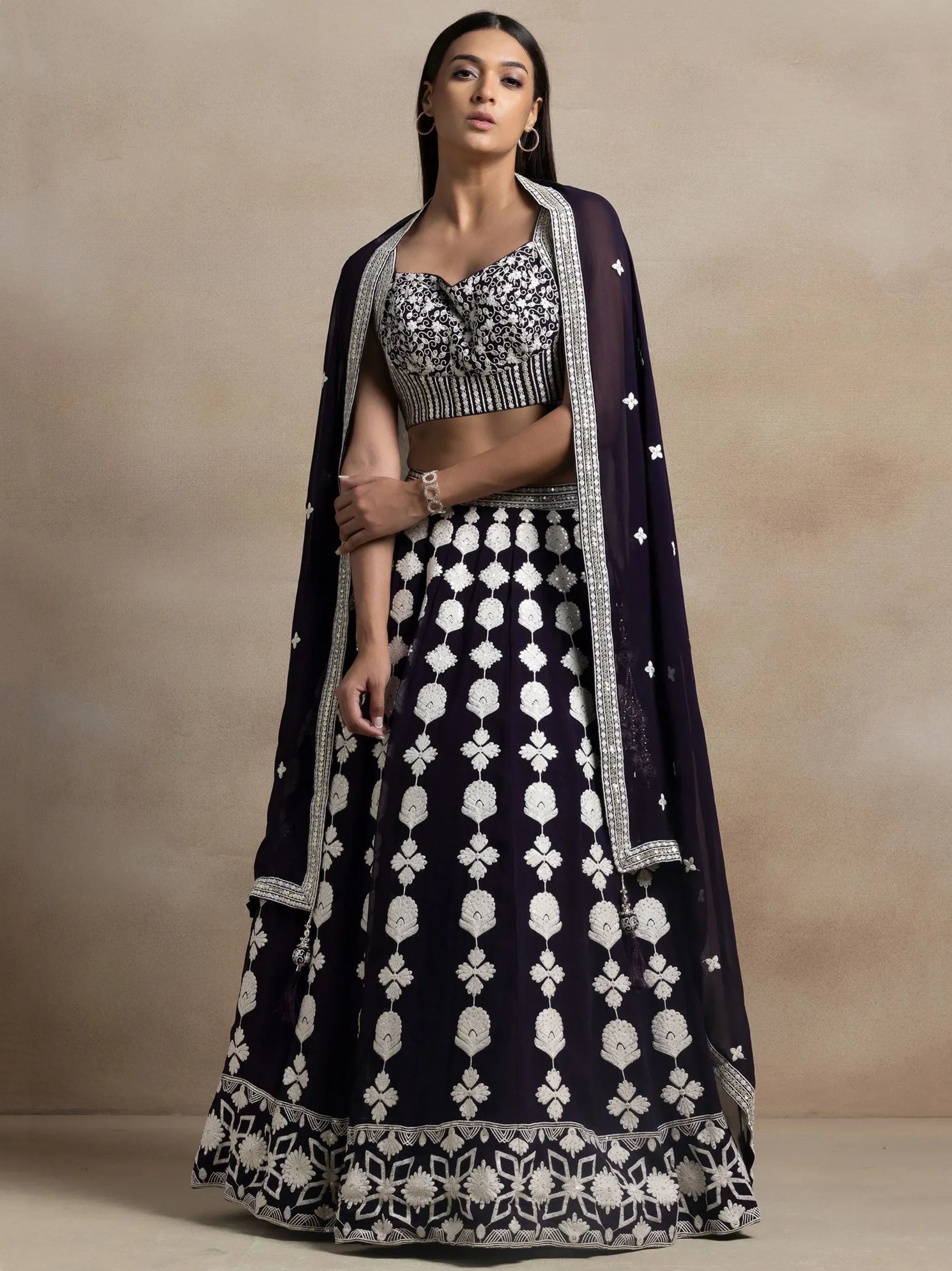 Navy blue lehenga choli with white floral embroidery, perfect for Indian ethnic wear occasions