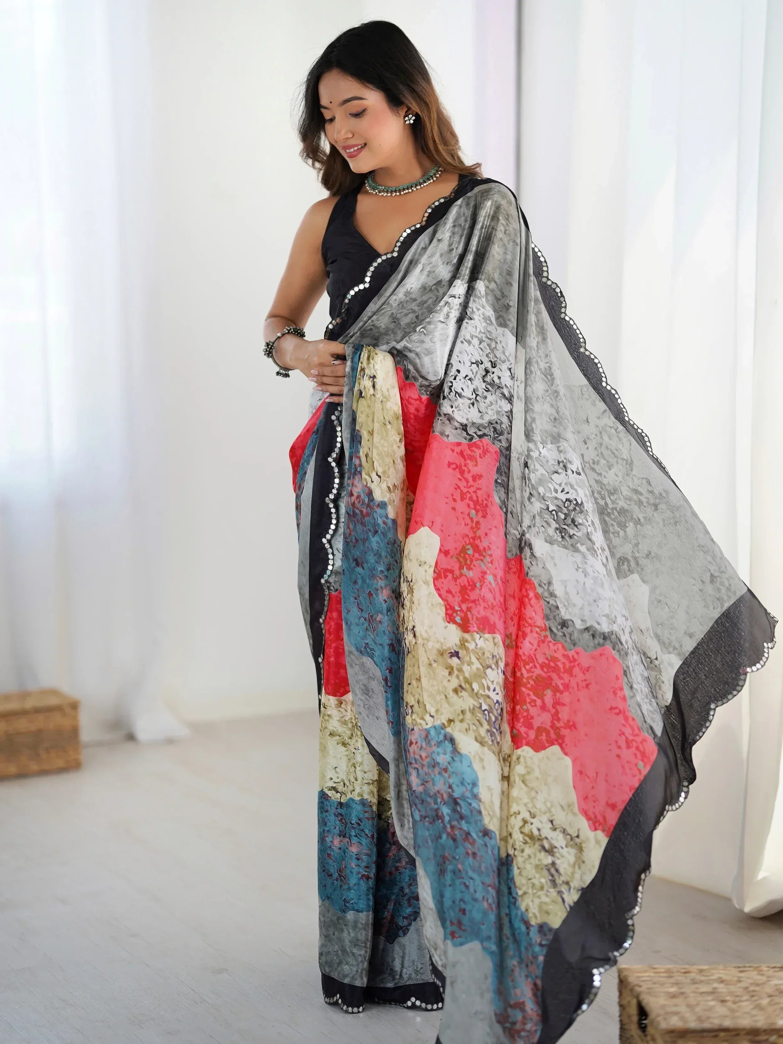 Woman in colorful abstract print saree with sequin border, Indian ethnic wear