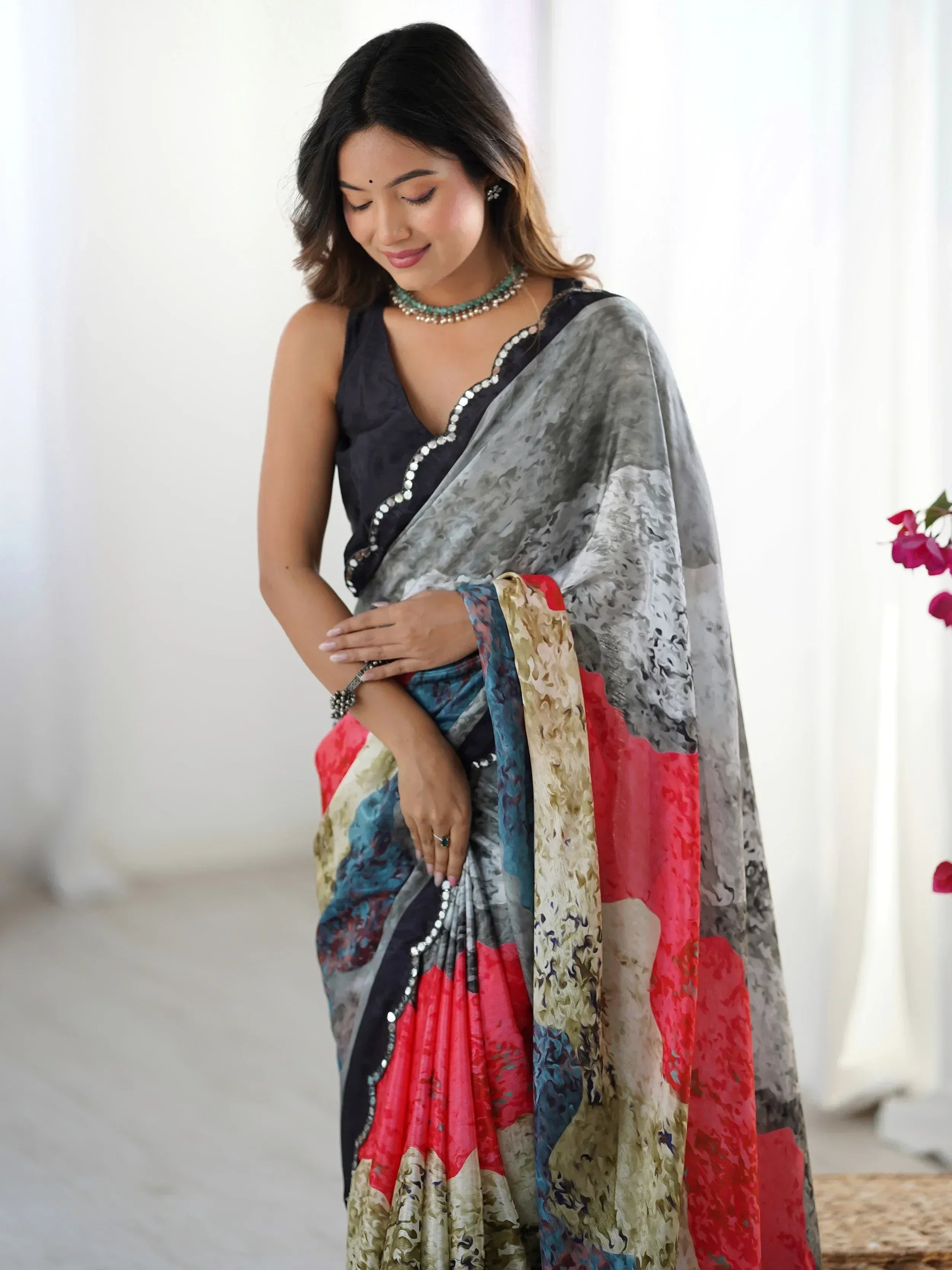 Woman in elegant printed saree with black blouse, perfect for Indian ethnic wear occasions