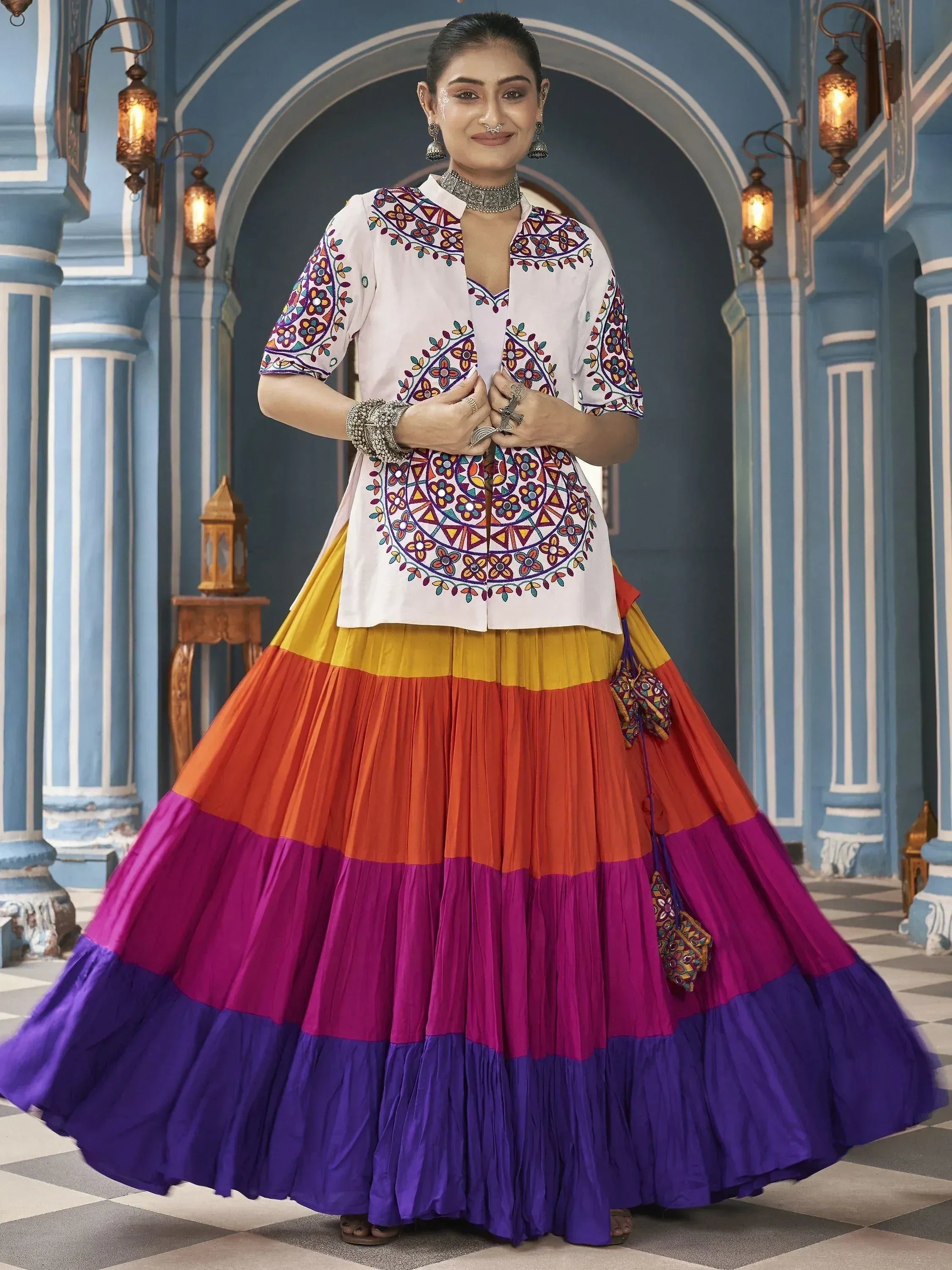 Colorful embroidered ethnic outfit with tiered skirt and floral patterns
