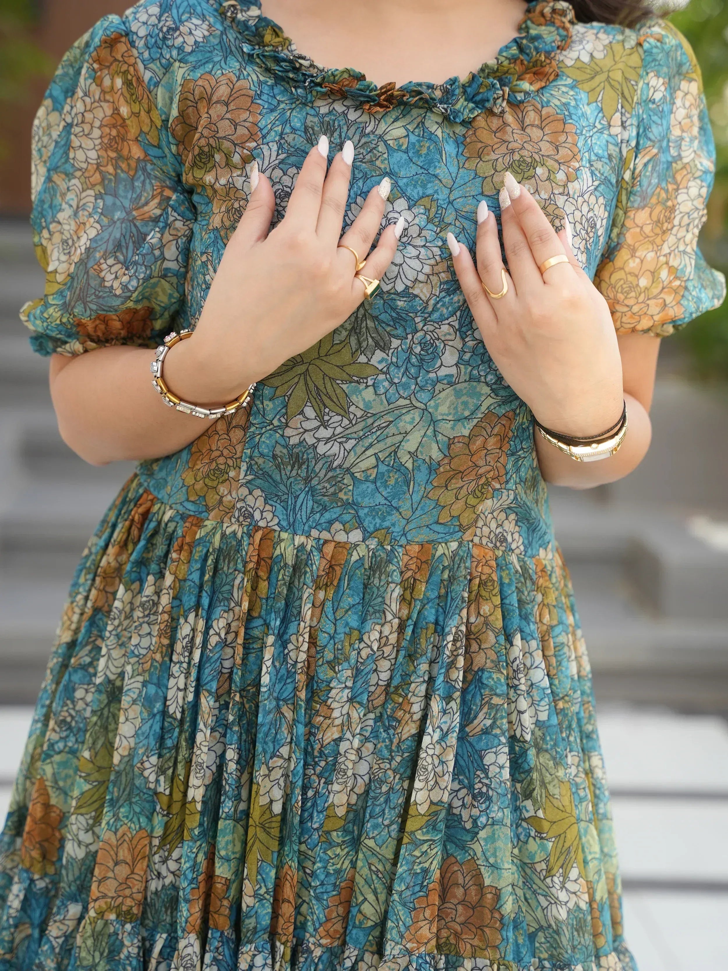 Floral print ethnic gown with ruffled neckline and puff sleeves, perfect for Indian occasions