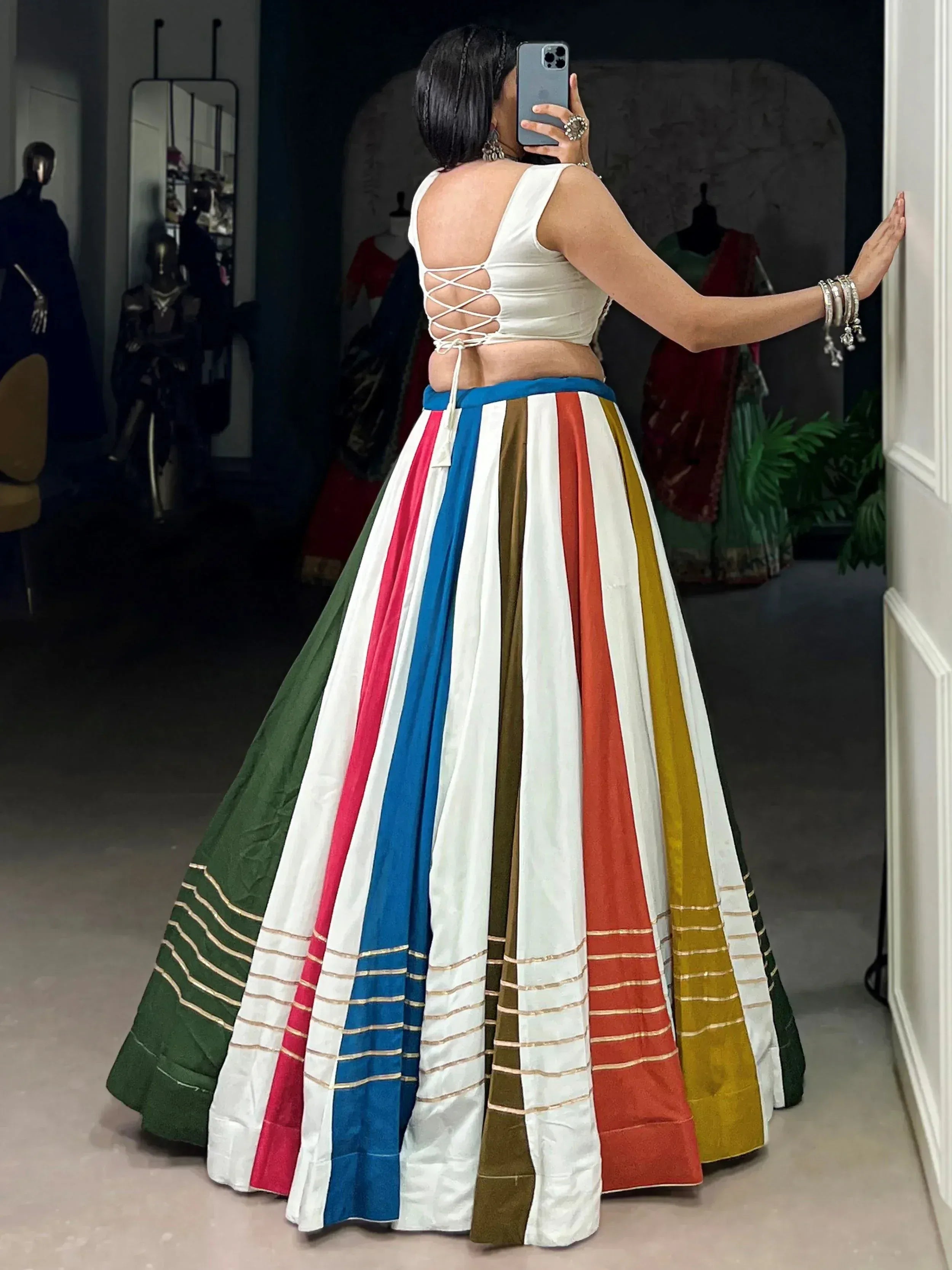 Woman in colorful striped lehenga with back-tie blouse, Indian ethnic wear