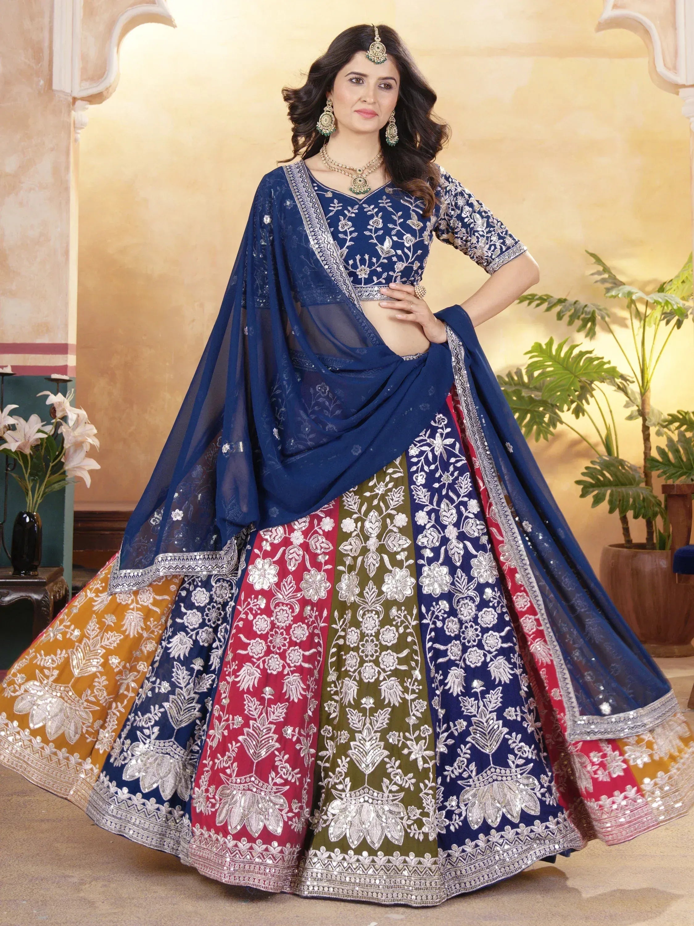 Blue embroidered lehenga choli with multi-color skirt, perfect for Indian weddings and festive occasions