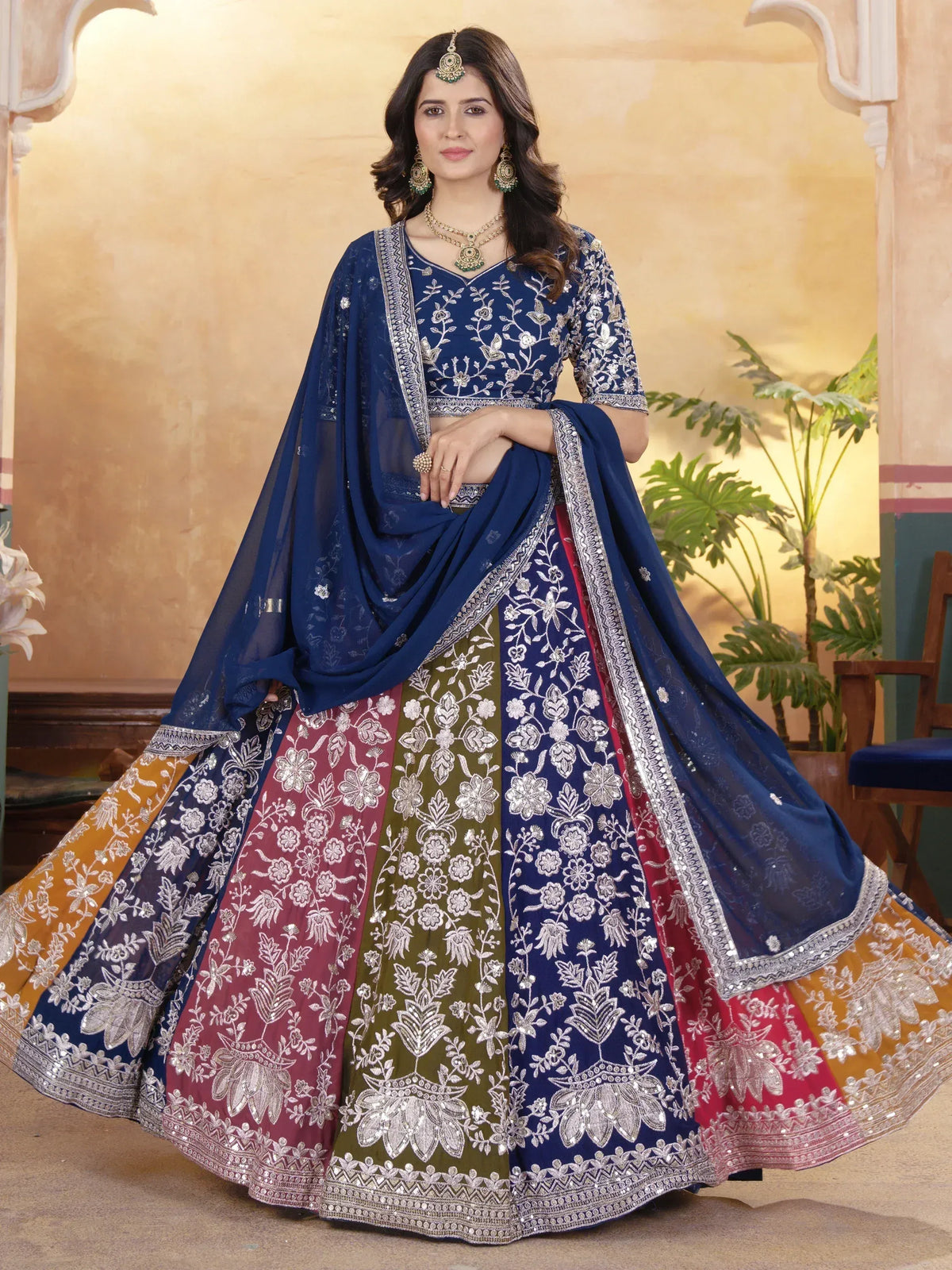 Blue floral embroidered lehenga choli with multi-color skirt, perfect for Indian weddings and festive occasions