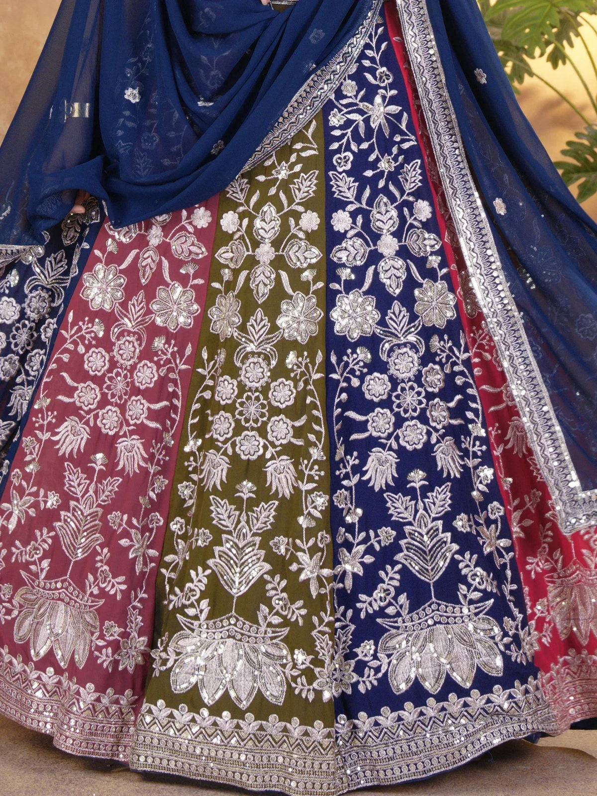 Elegant Indian ethnic wear with floral embroidery in navy, olive, and maroon, perfect for festive occasions.