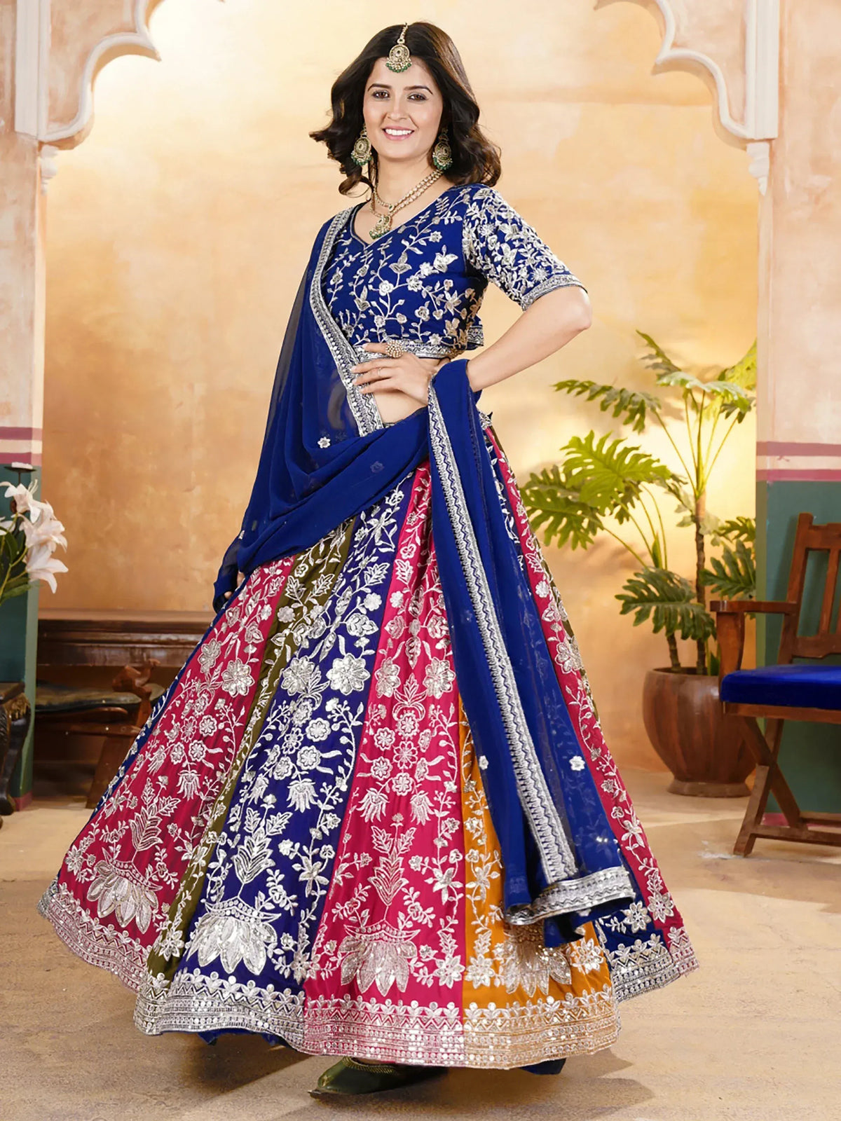 Blue and pink embroidered lehenga choli with floral design, perfect for Indian ethnic wear occasions