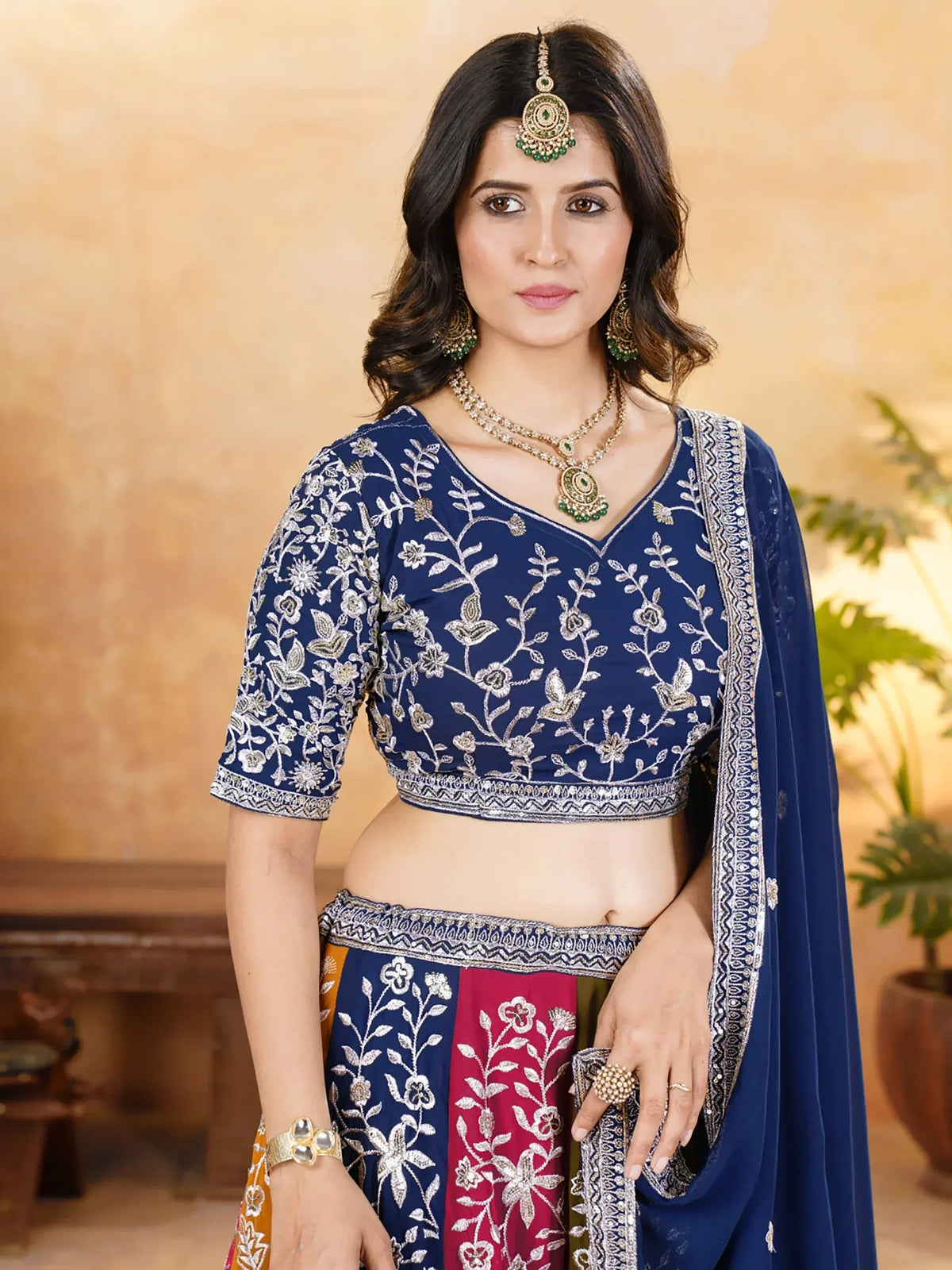 Navy blue embroidered lehenga choli with floral motifs, perfect for Indian ethnic wear occasions