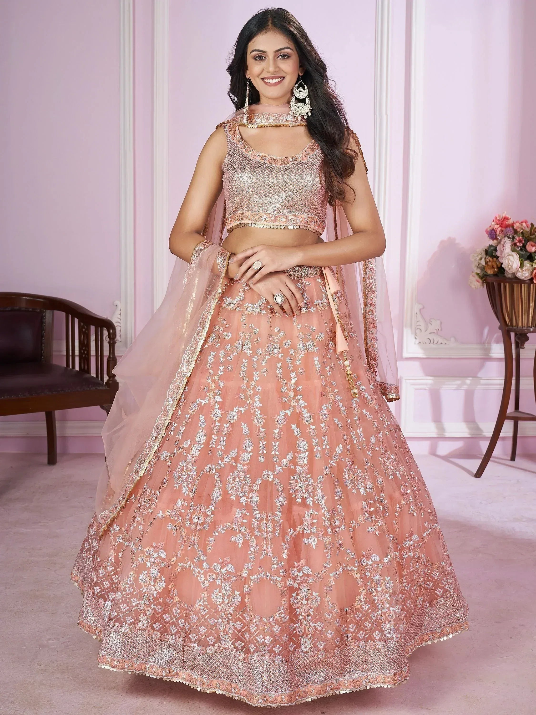Pink embroidered lehenga choli with net skirt and dupatta, perfect for Indian weddings and festive occasions