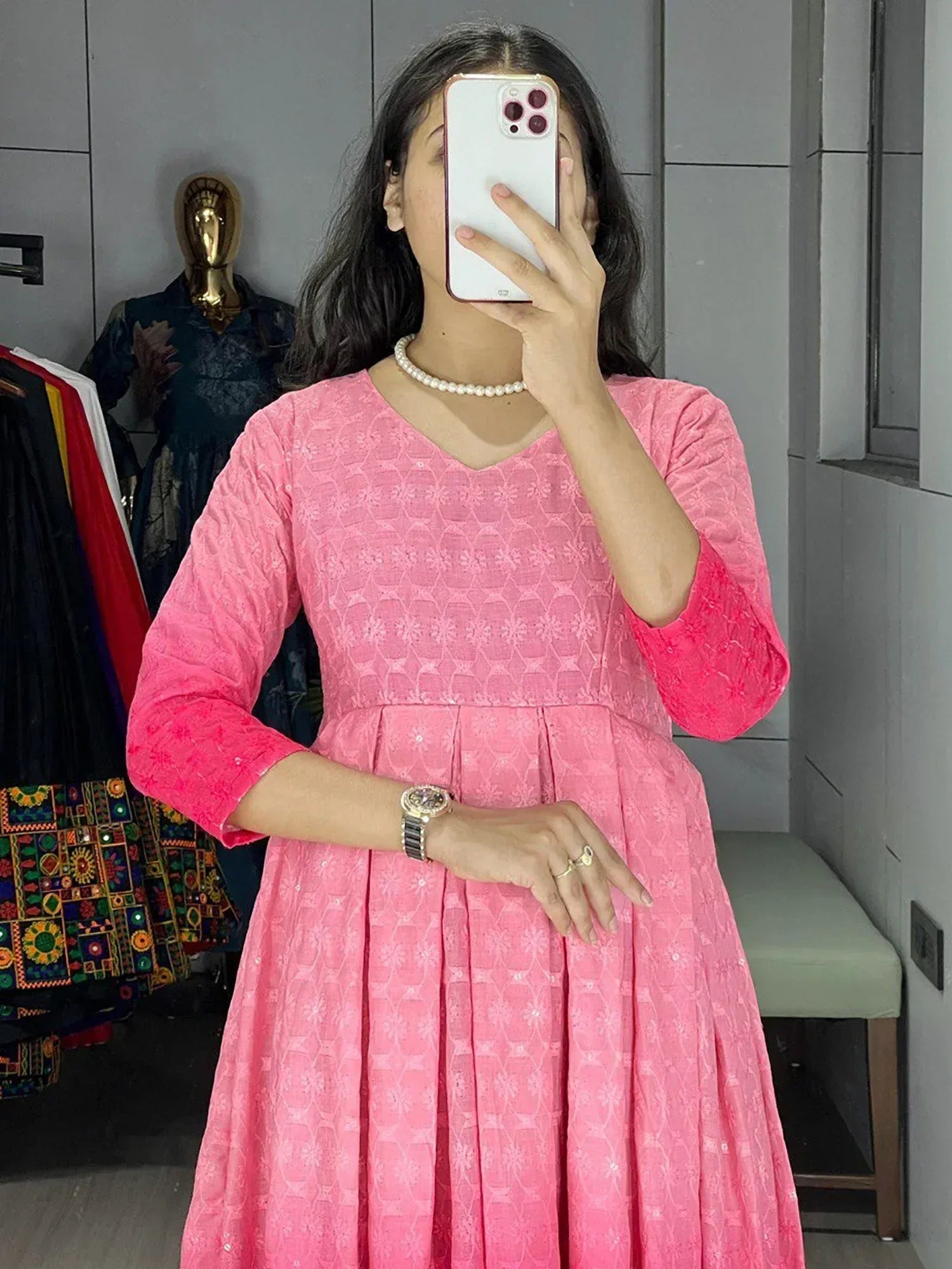 Pink ethnic gown with floral pattern, V-neck, and 3/4 sleeves, perfect for Indian occasions