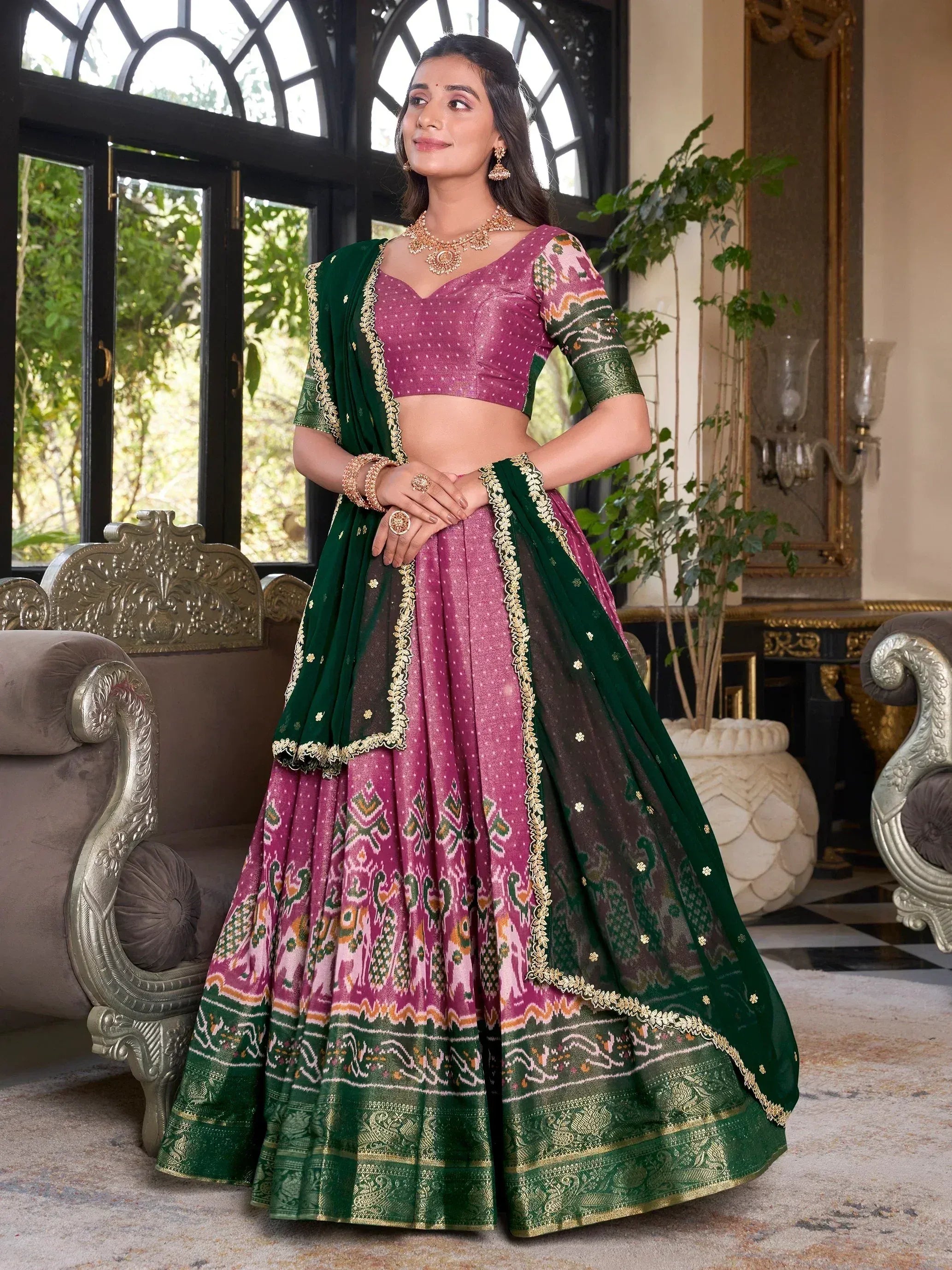 Elegant purple and green designer lehenga choli with gold embroidery, perfect for Indian weddings and festive occasions.