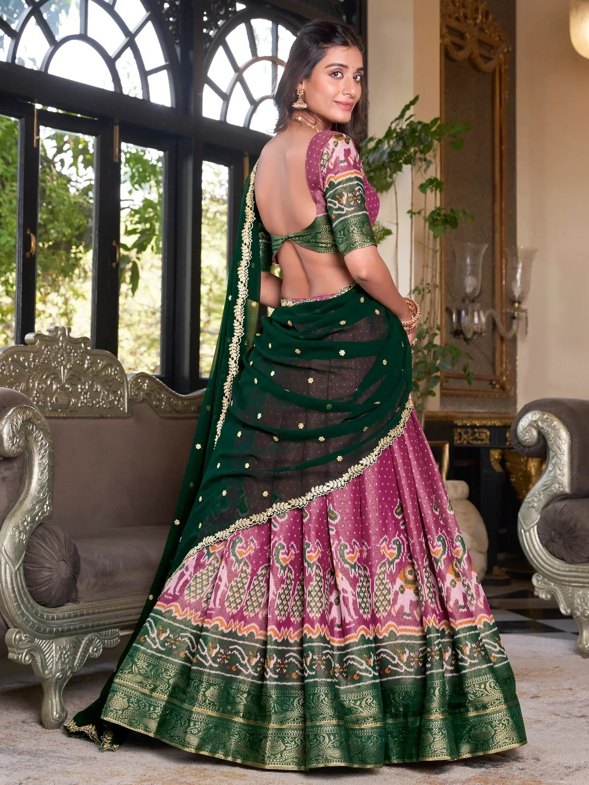 Elegant green and pink printed lehenga choli with backless blouse, perfect for Indian ethnic wear occasions