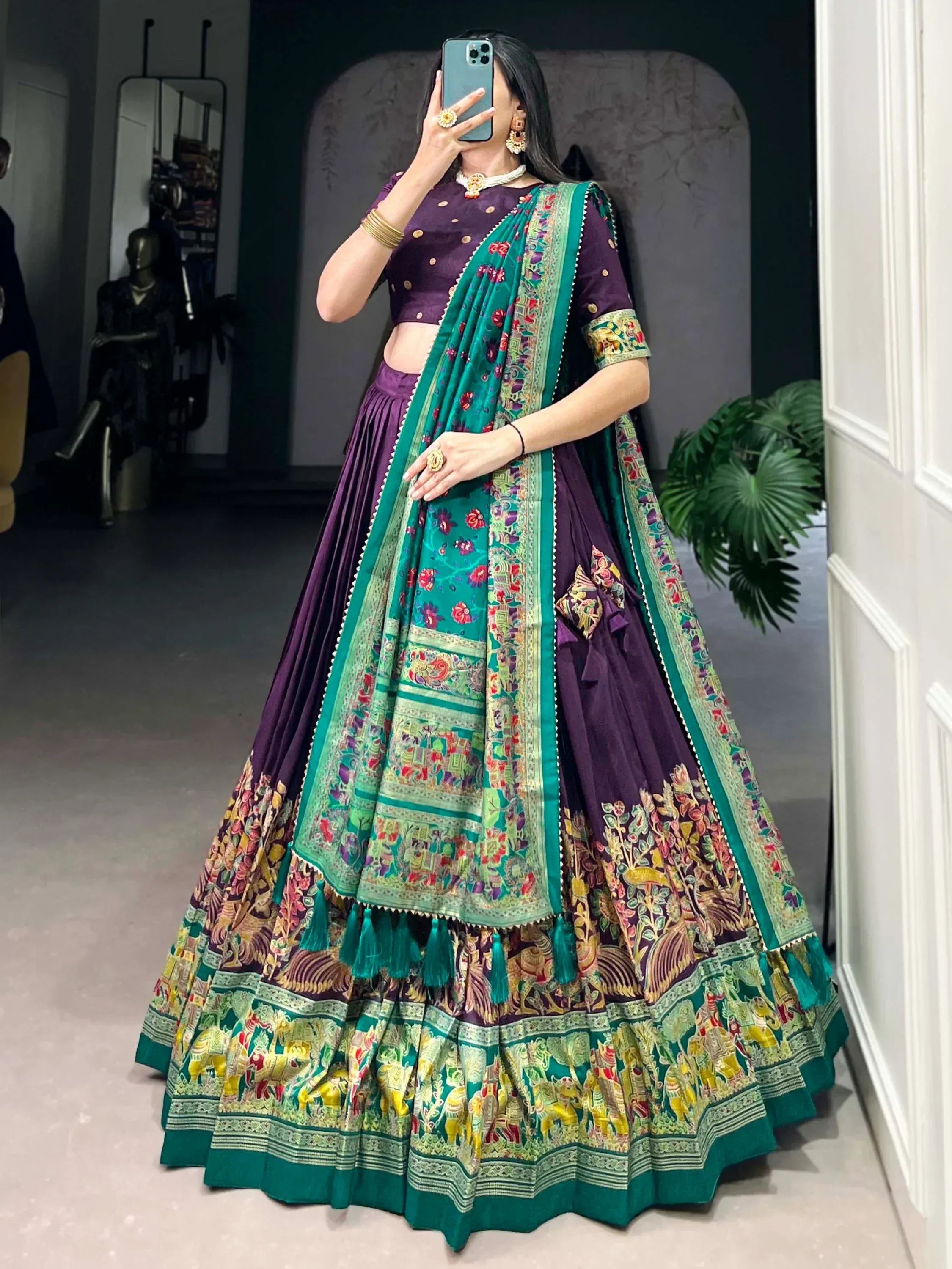 Purple and green designer lehenga choli with intricate floral and elephant print, perfect for Indian ethnic wear.