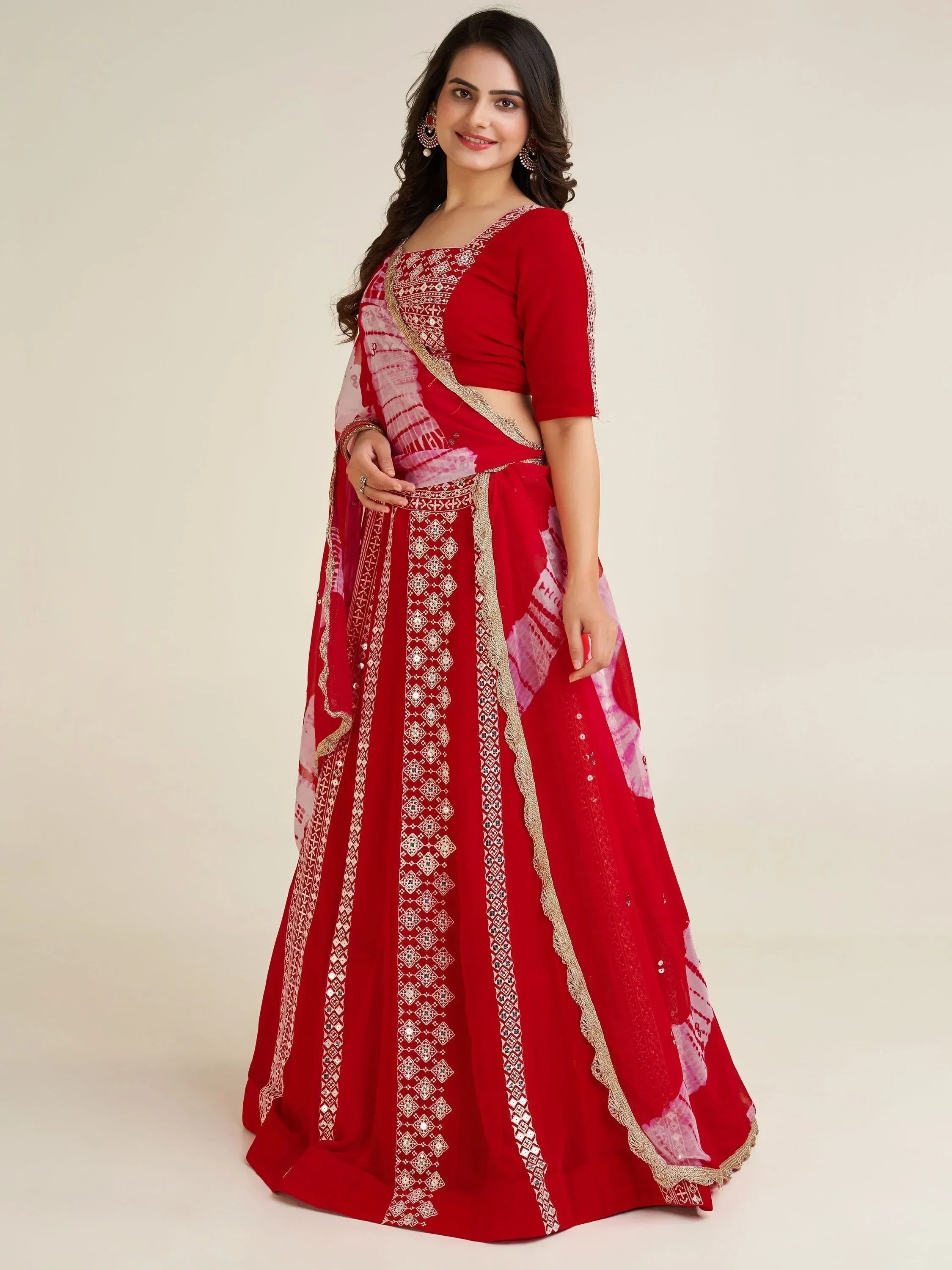 Red embroidered lehenga choli with gold detailing and pink dupatta for Indian ethnic wear
