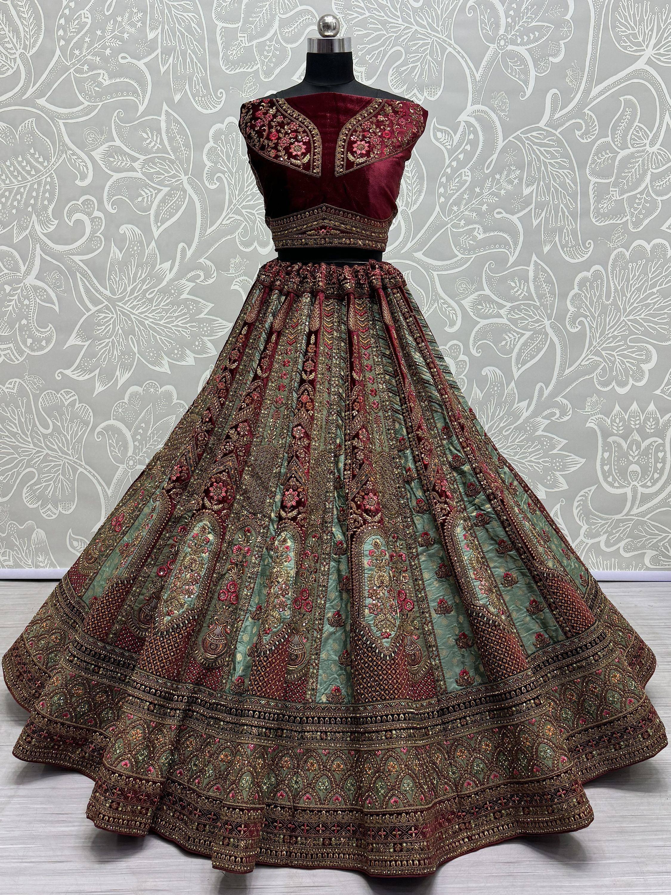 Maroon velvet designer lehenga choli with heavy gold embroidery and green skirt, ethnic Indian wear