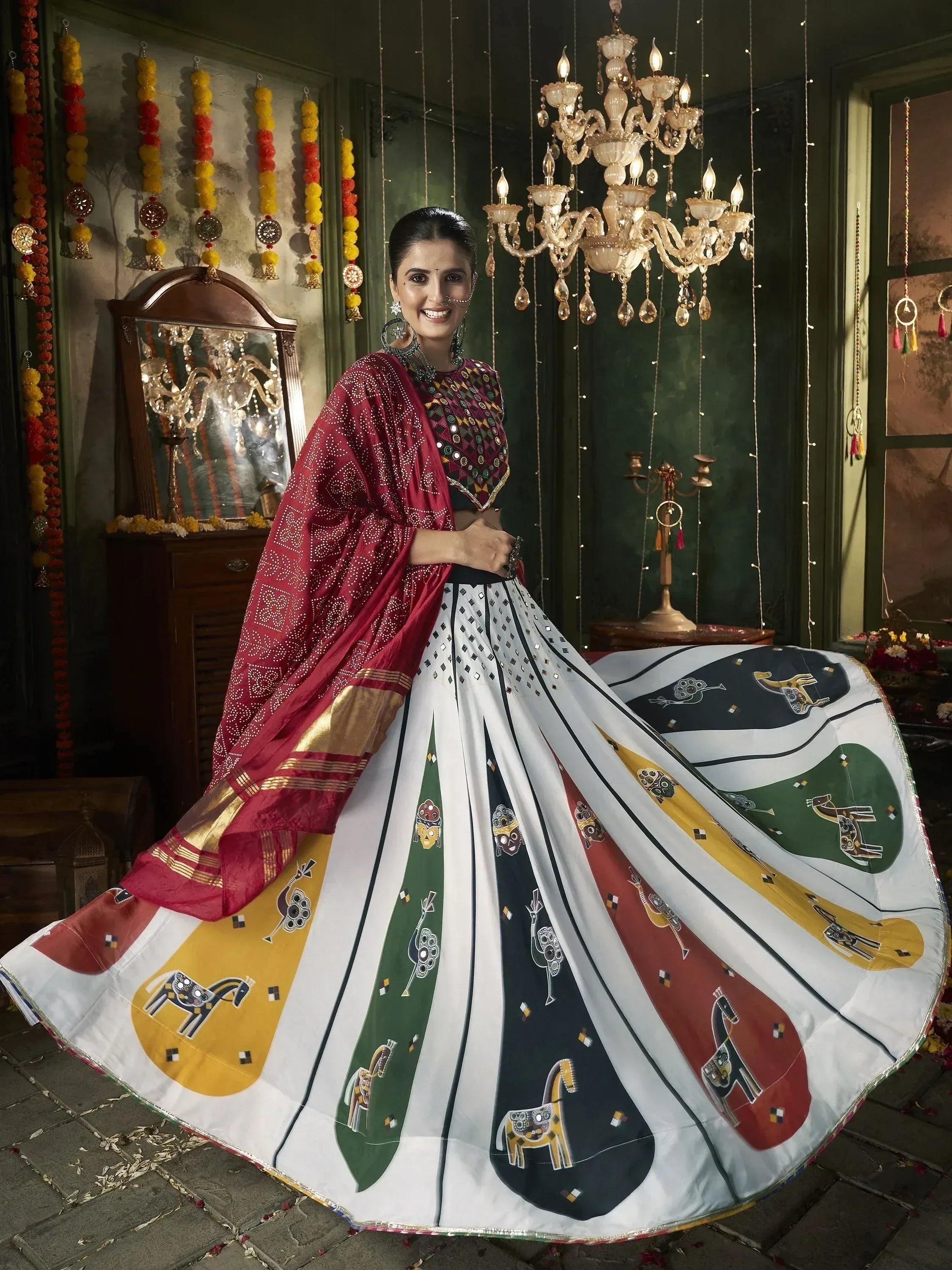 Woman in colorful printed lehenga choli with mirror work, festive Indian ethnic wear for celebrations