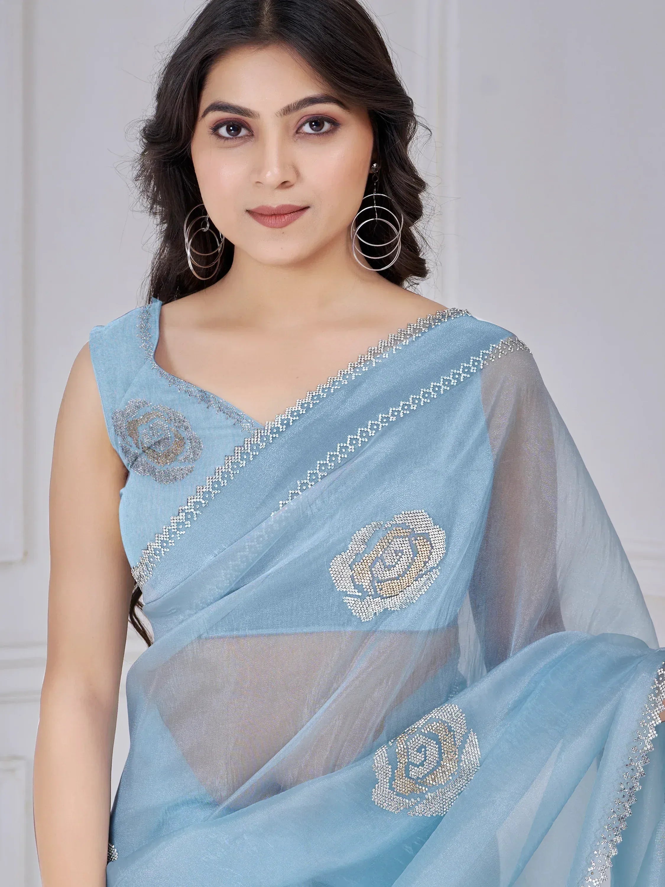 Light blue saree with floral stone embroidery, perfect for Indian ethnic wear occasions