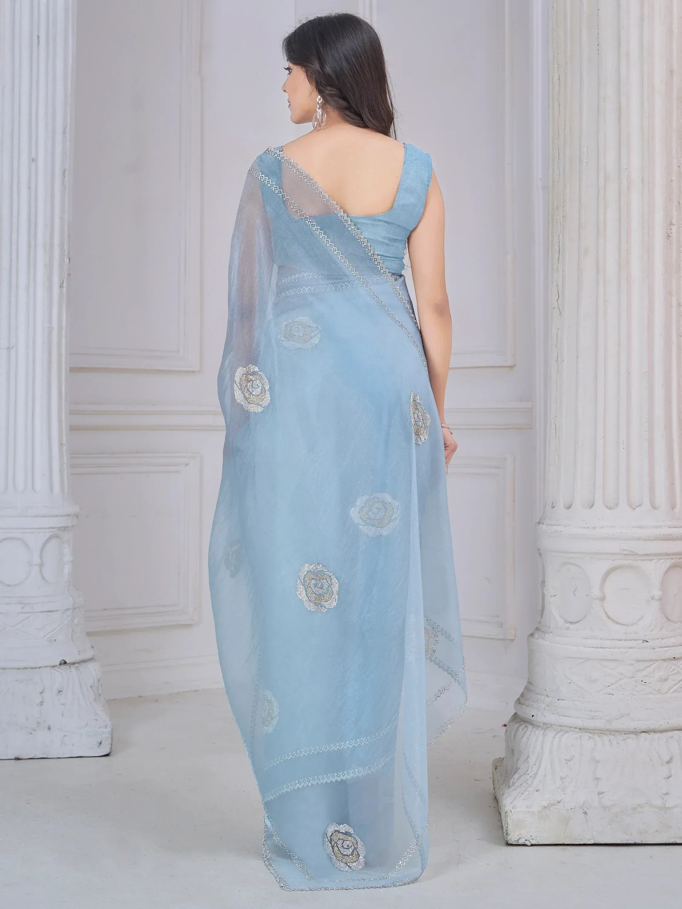 Light blue designer saree with floral embroidery and silver border, elegant ethnic wear for women