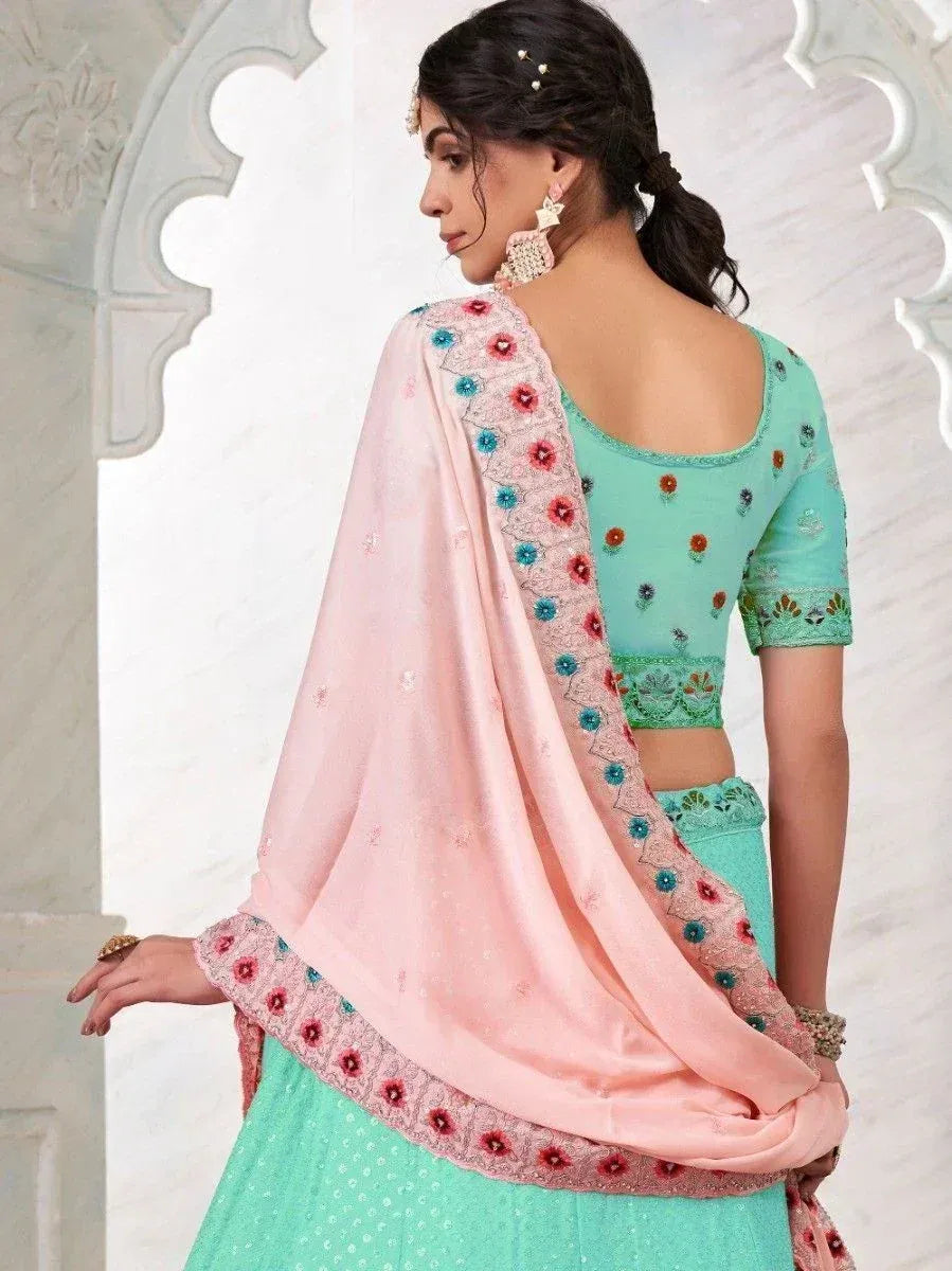 Mint green embroidered lehenga choli with pink dupatta, perfect for Indian ethnic wear occasions