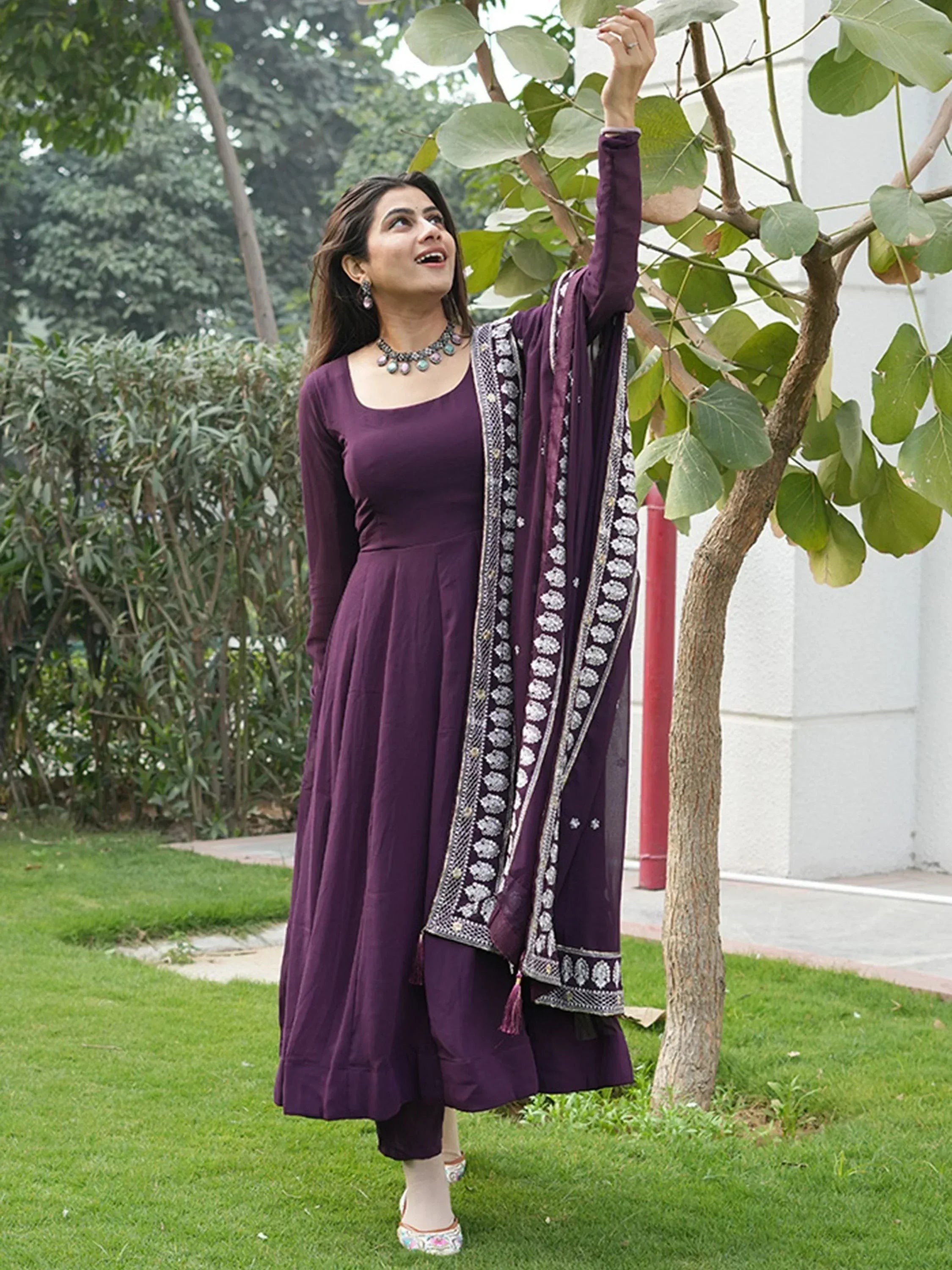 Purple ethnic anarkali suit with embroidered dupatta, perfect for Indian occasions and festive wear.
