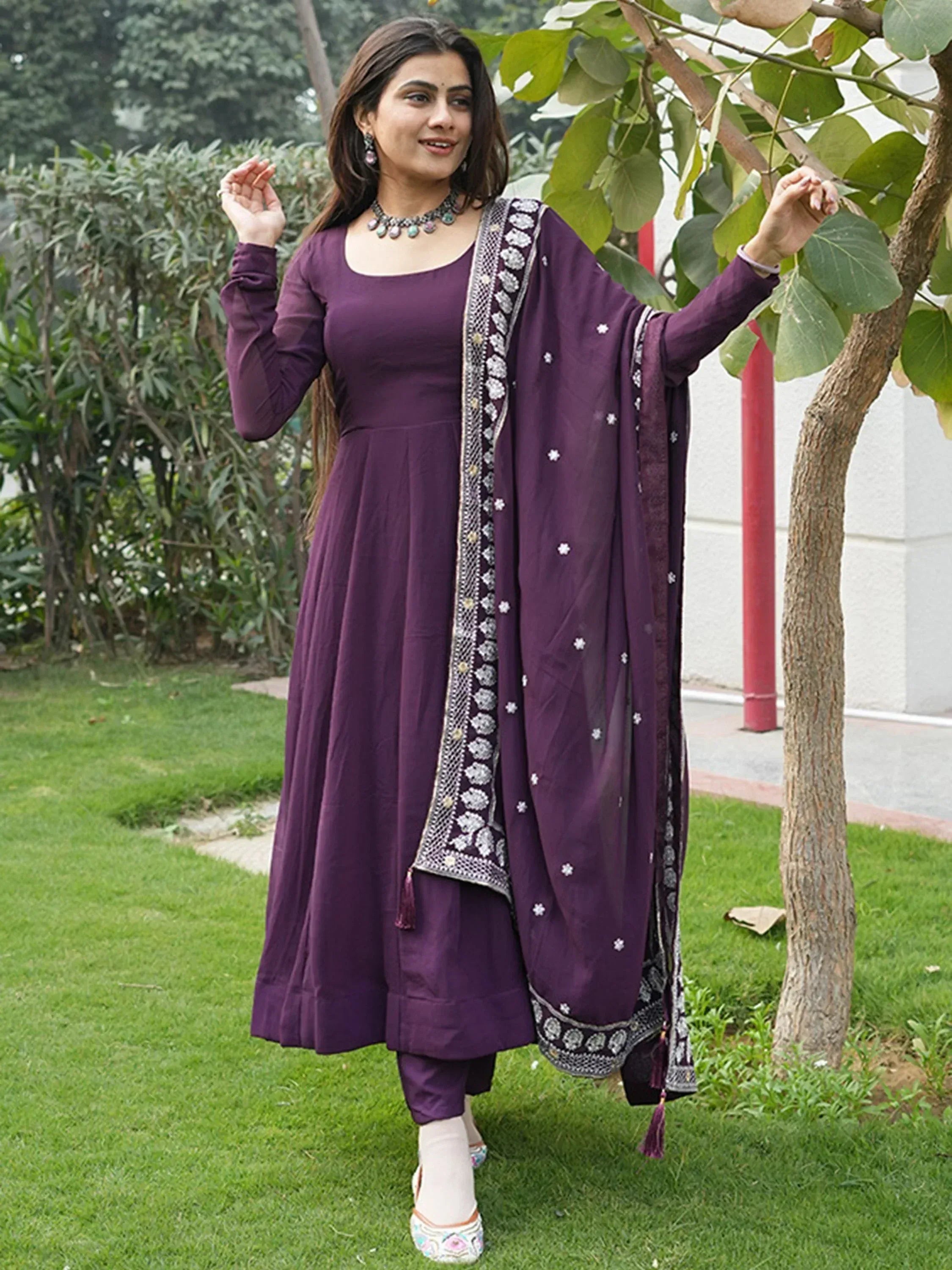 Purple ethnic anarkali suit with embroidered dupatta, perfect for Indian occasions and festive wear.