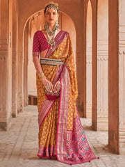 Enthralling Mustard Yellow Patola Printed Silk Traditional Saree