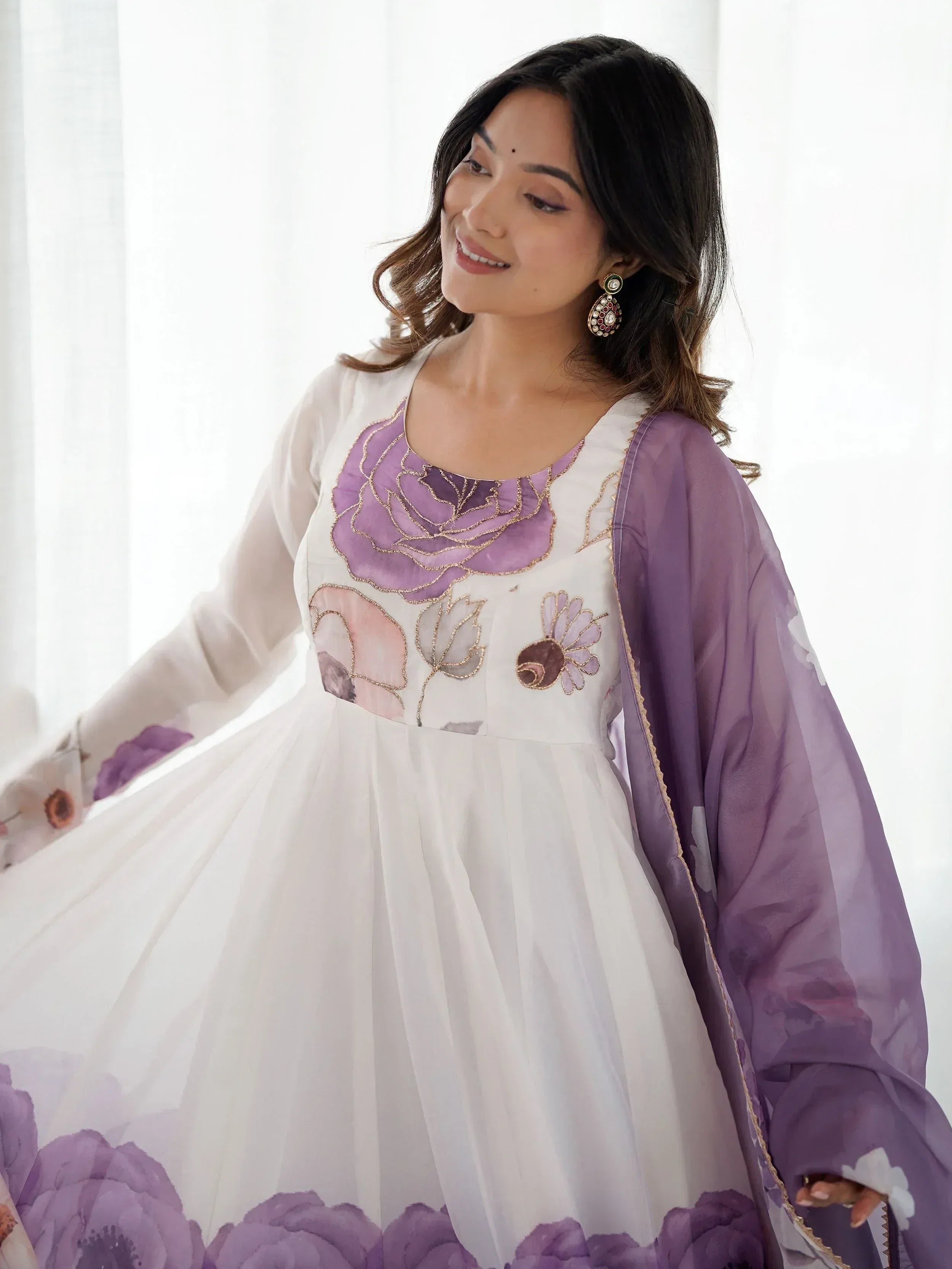 White and purple floral embroidered ethnic gown with matching dupatta, perfect for Indian occasions